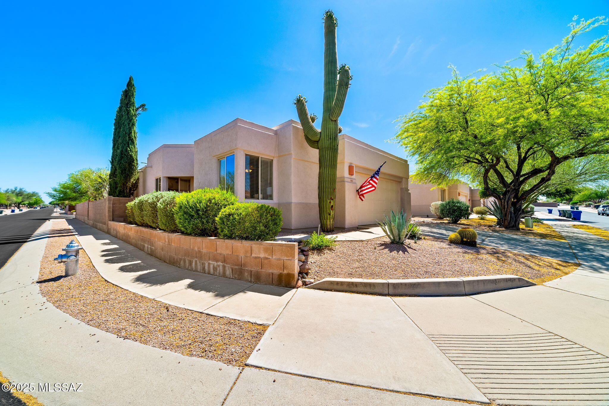 Tucked in a gated community directly across from Udall Park, this well-kept 3-bedroom, 2-bath home offers Catalina Mountain views and sits on a spacious corner lot with five fruit trees. Recently reduced -- a must-see.