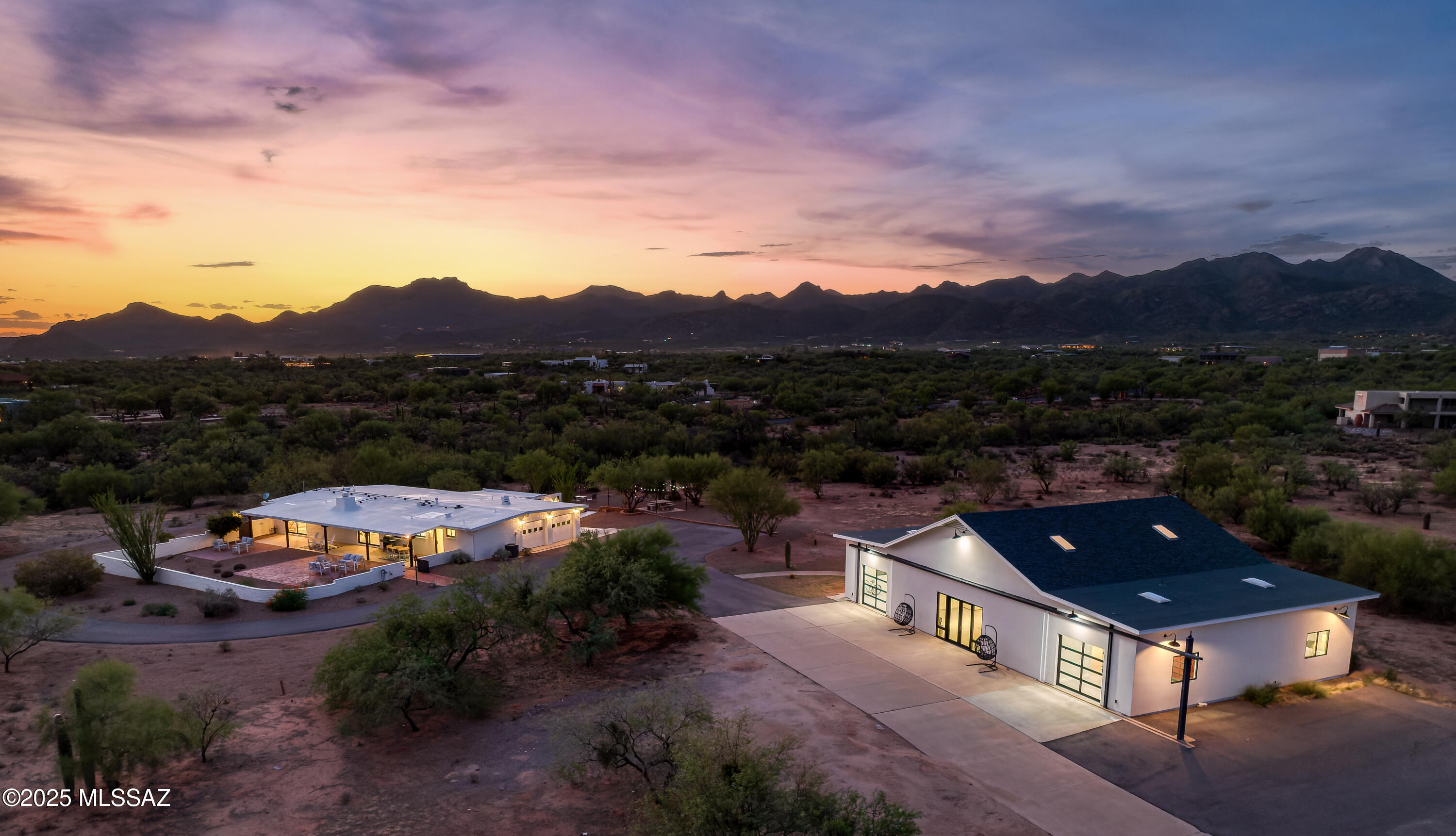 Exceptional fly-in/fly-out 7.23-acre La Cholla Airpark property with panoramic mountain views. This is more than a home—it's a lifestyle destination. Whether you're a pilot, horse enthusiast, or simply someone who values privacy and space, this property delivers it all in one complete package. Follow a long driveway through a timber entryway to find two meticulously renovated, separate residences.  The original burnt adobe ranch-style home has been modernized. An open floor plan with all new metal clad windows and doors that fill the space with natural light and frame exquisite mountain and desert views.  New kitchen with a waterfall granite peninsula/breakfast bar, new cabinetry, appliances, fixtures, and a butlers pantry. Continued... The nearby half-bath is perfectly placed for guests indoors or out. The family room with a gas fireplace  is open to the kitchen. All new ceramic tile floors throughout (no carpet), extensive decorative tile work adding polish and style, and all new bathrooms. The attached 2-car garage has a large storage room and built-ins.  Enjoy Tortolita Mountain views from the north patio or Pusch Ridge views from the walled-in south yard, underneath the deep covered patio that spans the length of the home. The second residence, once the aircraft hangar, has been thoughtfully redesigned into a versatile living space with a new kitchen,  2 bedrooms, 2 bathrooms, 2 offices, 2 additional garage spaces, and a laundry room.The second residence can easily be converted back to into a hangar for your aircraft (hangar doors convey with home), a garage to showcase a car or motorcycle collection, or tailored to your vision-whether for multi-generational living, a guest retreat or a place to store and work on your plane or car. Enjoy the convenience of direct access to the private, 4,500-foot paved and lighted runway, where you can take off and land right from your backyard. For equestrian lovers, the expansive lot size offers room for stables, arenas, and parking for trucks and trailers. Here, you'll find the perfect blend of wide open spaces, aviation convenience, and proximityjust minutes from Oro Valley's shopping, dining, and amenities.
This desert retreat offers privacy, versatility, and breathtaking Arizona beauty.
Sought-after Oro Valley, recently rated the "Safest and Wealthiest Retirement Community" by gobankrates.com ahead of Prescott, Scottsdale, Rancho Palos Verdes, Laguna Woods, Walnut Creek, La Quinta, Seal Beach, Rancho Mirage, Palm Desert, Palm Springs, and many more.
Golf: The Stone Canyon Club and the Clubs at Dove Mountain are minutes from La Cholla Airpark. Stone Canyon is a hidden gem nestled against the picturesque Tortolita Mountains in the town of Oro Valley, just northwest of Tucson, Arizona. This private golf community boasts over 1,400 acres of breathtaking land and is highlighted by a Jay Morrish designed world-class golf course. Stone Canyon is the only golf course in the greater Tucson area to have been ranked in the top 100 golf courses in America by Golf Digest. Accompanied by a luxurious Health & Fitness facility and a modern restaurant, Stone Canyon leaves no stone unturned in providing you with all the comforts one could desire. Enjoy our many golf, social, and fitness events hosted consistently throughout the year.Two Clubs, One Remarkable Membership. The Clubs of Dove Mountain are made up of The Gallery Golf Club and The Golf Club at Dove Mountain (Ritz Carlton Dove Mountain) and sit within the beautiful Dove Mountain community, surrounded by the Tortolita Mountains.
Tennis and Pickleball: Both public and private tennis and pickleball courts are everywhere you go in Oro Valley. The beautiful Arizona weather attracts visitors from all over the country and the globe who come here to play tennis and pickleball.
Hiking: This home is located less than 10 minutes from Catalina State Park. Catalina State Park sits at the base of the majestic Santa Catalina Mountains. The 5,500 acres of foothills, canyons, and streams invite camping, picnicking, and bird watching. The park offers miles of equestrian, birding, hiking, and biking trails that wind through the park and into the Coronado National Forest.
Biking: The Loop is a system of 138 miles of paved, shared-use paths and short segments of buffered bike lanes connecting the greater Tucson area. One of the best locations to connect to the loop is in Oro Valley. The most popular starting point is the centrally located Rillito River section of The Loop, located on the 4500 block of North First Avenue. This portion of The Loop has the most "things to do" including restaurants, parks, robust shopping, bars, and more.
The Oro Valley Aquatic Center is  southern Arizona's finest competition-level facility, with a 50-meter competition pool, a 25-yard recreation pool,  a water slide, a splash pad for children and other family-friendly amenities.