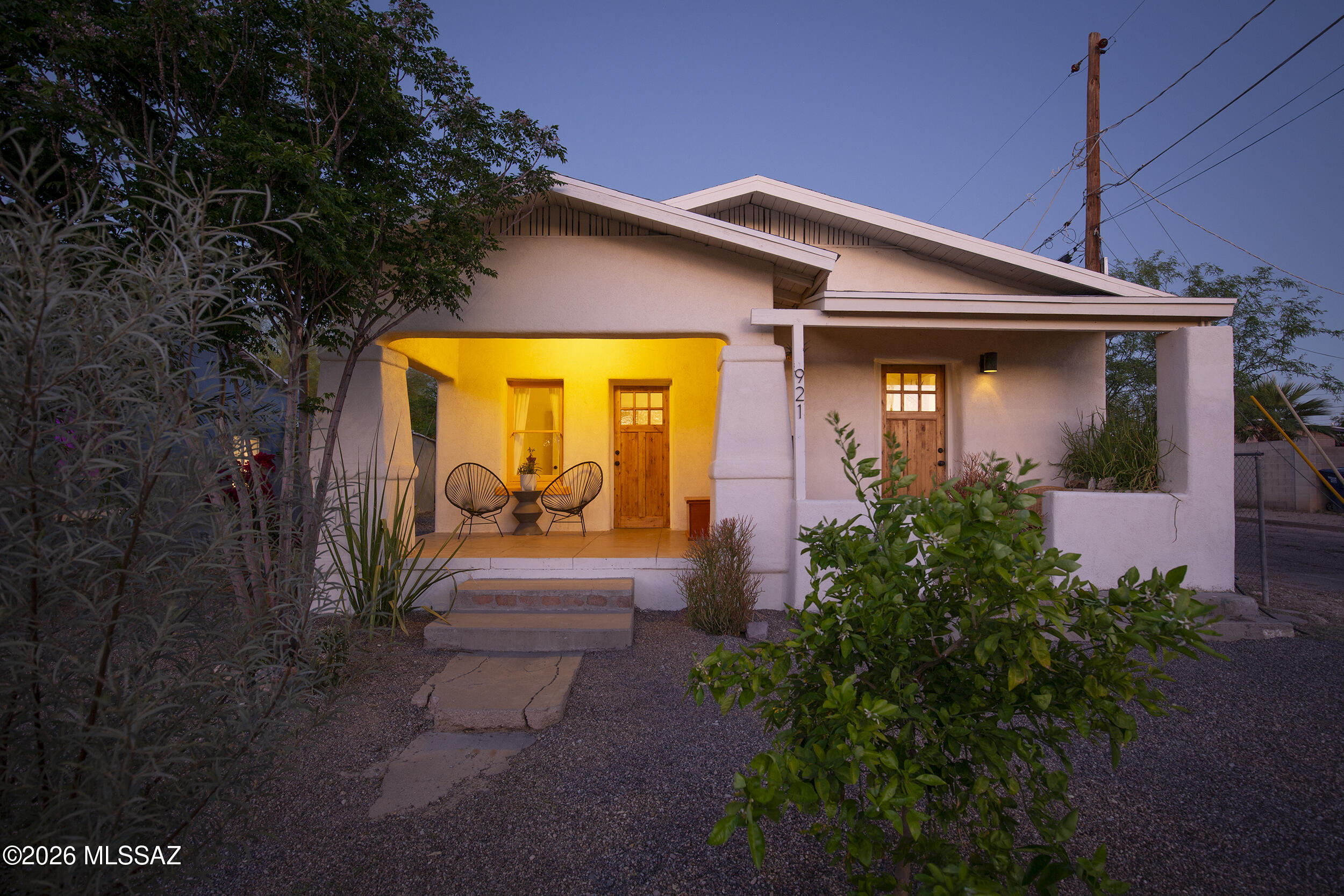 C. 1924 bungalow located in the historic Barrio Santa Rosa. Original wood and concrete floors reflect the home's layered history. Formerly configured as a duplex, the layout offers flexibility -- functioning as either a single family residence with two bedrooms and two bathrooms, or as two separate one-bedroom, one-bath units (approximately 495 sq ft and 850 sq ft). Vaulted ceilings and exposed layers of paint and plaster create texture and depth, while clay paint finishes contribute warmth and an authentic sense of time and place. The kitchen features sleek steel counters, blending modern simplicity with historic character. Located near Five Points, Rosebud Bakery, Forbes, and Downtown  Tucson, the home is positioned within one of Tucson's most culturally rich and significant neighborh