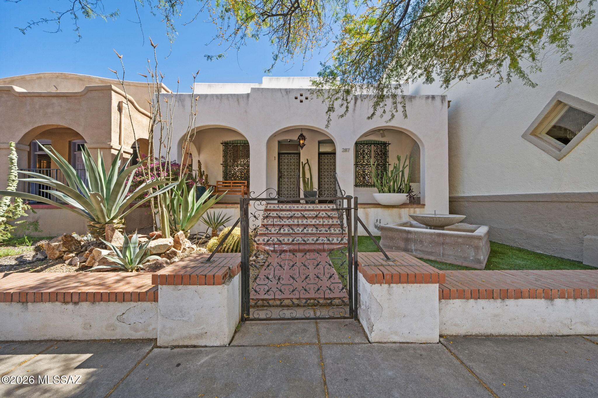 LOCATION, LOCATION, LOCATION! Located on South Scott Avenue, directly across the street from the Arizona Theatre Company, Temple of Music and Art and just 1-minute south of thriving Downtown, this gorgeous 1928-built DUPLEX affords incredible live-in and/or investment opportunities! Situated in the Historic Armory Park District with HC-3 zoning, the property can be used as both a residential or commercial dwelling/rental - live in one side and operate your business out of the other! Charm galore inside with many original details, including grand ceilings, over-sized windows, solid wooden doors, original hardwood flooring, but still including upgrades like a modern kitchen with tasteful white cabinetry, black & white checker flooring, stainless steel prep island, and commercial-grade appliances! Unit 1 houses 1-bedroom, a living area, kitchen, and combined laundry/mud room. Unit 1 is currently used as an Airbnb and is ready to be lived-in. Unit 2 is an open studio space with a kitchenette, bathroom and laundry room in the rear, perfect to be used as a live-in art studio or home office - the possibilities are endless. Each unit houses gorgeous bathrooms with black & white tile finishes in the stand-up showers. The passage between both units has been sealed off but can easily be re-opened to create one large single-family home or office space. Out back you can enjoy a large paver parking pad, suitable for up-to 3 cars. Don't need the extra space? Close off a portion to create a serene backyard patio oasis. Living Downtown means walkability with access to the SunLink Street Car that takes you west to the Mercado District and loops back as far east as UArizona and Banner Main Campus. Downtown Tucson offers endless eatery options and venues like the Fox and Rialto Theaters - venture out in the cool evenings to enjoy Tucson's nightlife! This charming home is a MUST-SEE! You'll never want to leave.