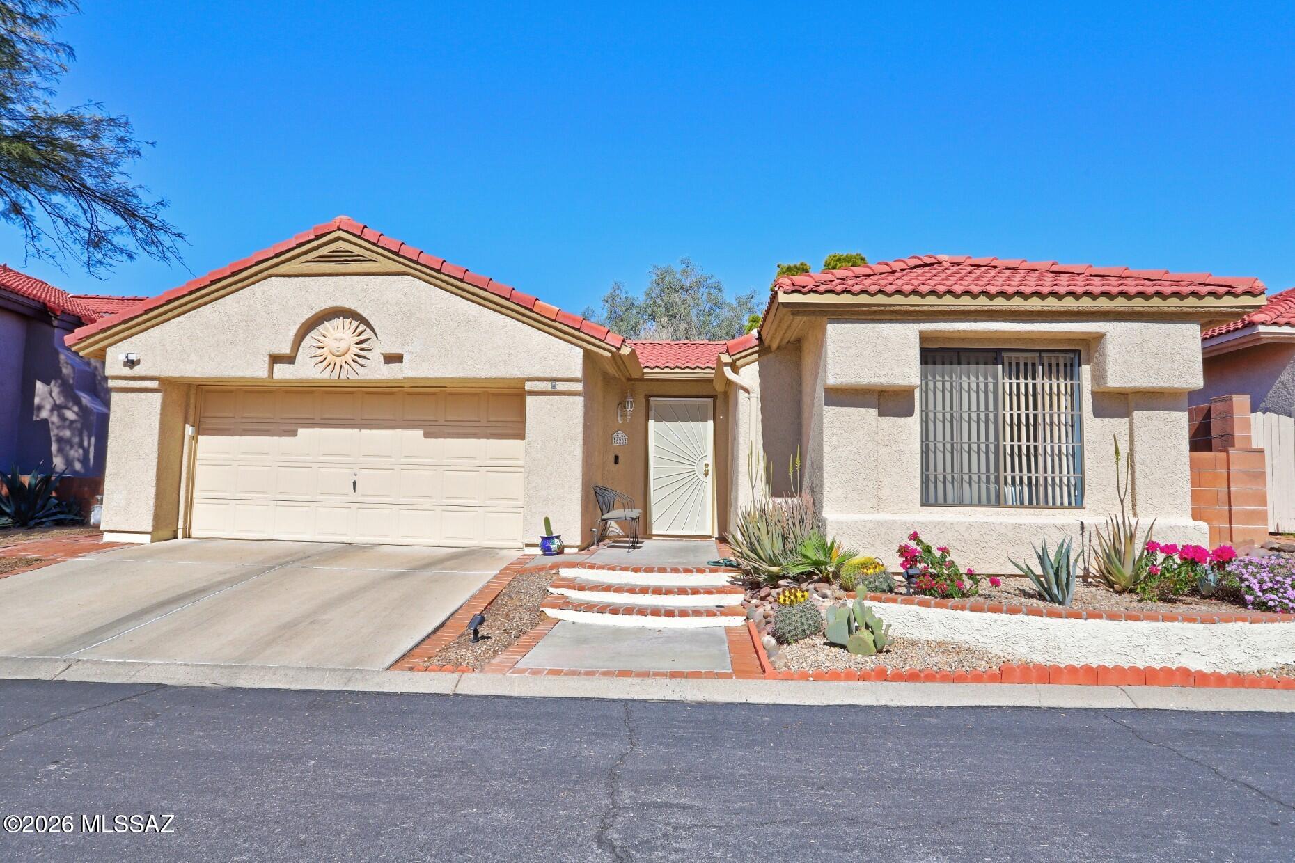 Cute, Cozy & Comfortable Home in Desirable Lambert Lane Community in the Heart of Oro Valley.  Great Front curb appeal & no house behind home.  3 bed/2 bath 1313 sq ft.  Split Bedroom Plan.  Open Livingroom & Dining Room.  Raised Fireplace in Livingroom. with sliding glass door to private patio.  Breakfast area in Kitchen, Kitchen with granite counters, stainless Kenmore french door refrigerator, dishwashe,r GE 2024 Microwave.  All applainces convey including washer & dryer.  Ensuite owner suite has 2 large mirrored closets. Custom built bookcase on entire wall in BR3.  Could be office.  Double garage with newer garage door opener & attached work bench.  Hoa includes Pool, Spa, trash & common area.  Incredible location to walk to River front Park and convenient to shopping and restaurants.