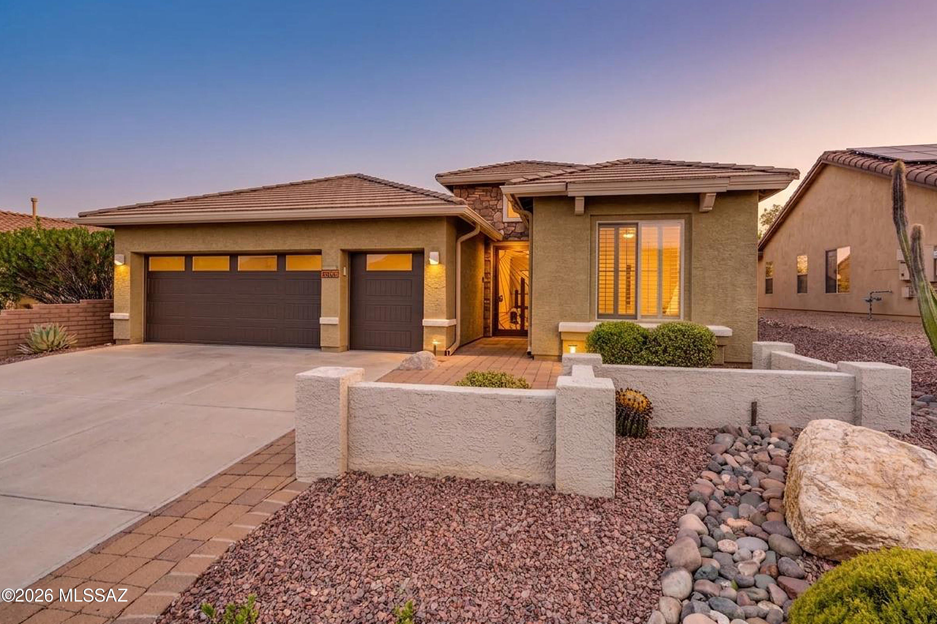 Outstanding curb appeal and numerous quality updates make this beautifully maintained Newport model a standout in Quail Creek. A welcoming front entry courtyard, security screen entry, and rich wood front door create an inviting first impression. Inside, the distinctive circular foyer opens to an airy great room floor plan offering 1,874 sq.ft., 2 BR, 2 BA, Den, and a desirable split-bedroom layout designed for comfortable everyday living and effortless entertaining. The remodeled kitchen is the centerpiece of the home, featuring an extended waterfall-edge quartz island with stainless sink and under-counter beverage cooler, custom tile backsplash, abundant oak cabinetry, walk-in pantry, and upgraded stainless steel appliances, including a gas range and French door refrigerator. The spacious dining area is expanded with a bay window and opens directly to the covered patio. The owner's suite is also extended with a bay window and includes a beautifully updated, custom tile roll-in shower. The den features rich engineered wood flooring, while tile floors flow throughout the main living areas, all complemented by plantation shutters throughout. Energy-efficient upgrades include R-9 insulated garage and insulated garage doors with dual pane windows, installed June 2023. 
 
The lush and mature rear landscaping creates a private backyard retreat, offering multiple conversation areas and established shade trees. A freestanding BBQ and custom built-in serving table with an under-counter beverage cooler and storage make outdoor entertaining a breeze. Completing the home is a 2.5-car garage with plenty of room for two vehicles and a golf cart. Thoughtfully updated, meticulously maintained, and move-in ready, this exceptional home offers the comfortable indoor-outdoor lifestyle Quail Creek is known for.