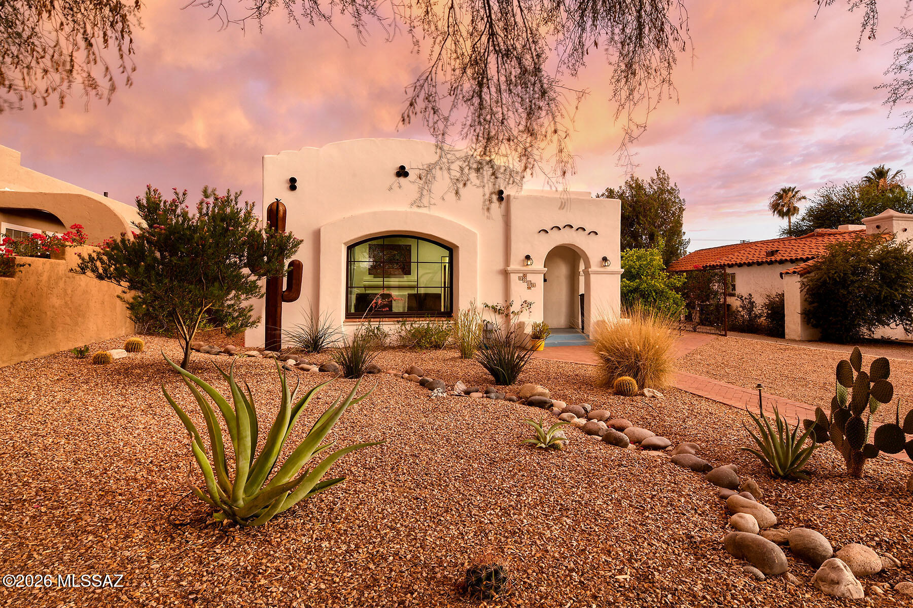 Timeless Spanish Moorish Charm with Modern Luxury & Income Potential
Beautifully restored 1936 Spanish Moorish residence featuring 2 bedrooms and 2 bathrooms, and a 1 bed 1 bath guest house.  The main home was thoughtfully remodeled preserving its original character and architectural details and extensively renovated in 2019 with updated electrical and plumbing systems, new Marvin windows, a tankless water heater, and restored original interior doors and hardware. The home has owned solar for the main home and the guest home. Main home has HVAC & Evaporative Cooling, plus the warmth and ambiance of a wood-burning stove with fan warms the whole home. The Cook's kitchen is highlighted by a custom BlueStar range and hood, built-in Miele coffee bar, ample storage, farm sink and whole-property water filtration system. The hall bathroom beautifully renovate with a claw foot bath tub.  The primary bathroom has an oversized pedestal tub & walk in shower primary ensuite bathroom has walk in shower, double vanity & walk in closet.  
The detached guest house and 2-car garage, both built in 2019, offer exceptional flexibility and value. The guest house features separate electric and gas meters, wireless Yale keyless entry, and shares the benefits of the property's solar system.
Step outside to a professionally designed backyard oasis featuring a built-in BBQ, custom tiled pizza oven, gas-burning fire pit, raised garden beds, landscape lighting on timers, and automated front and rear irrigation systems. Additional amenities include Hot Tub, custom metal garden shed, electric sliding rear gate, and parking for up to six vehicles.
A rare blend of historic character, modern upgrades, energy efficiency, and exceptional outdoor living, this one-of-a-kind property is truly move-in ready.