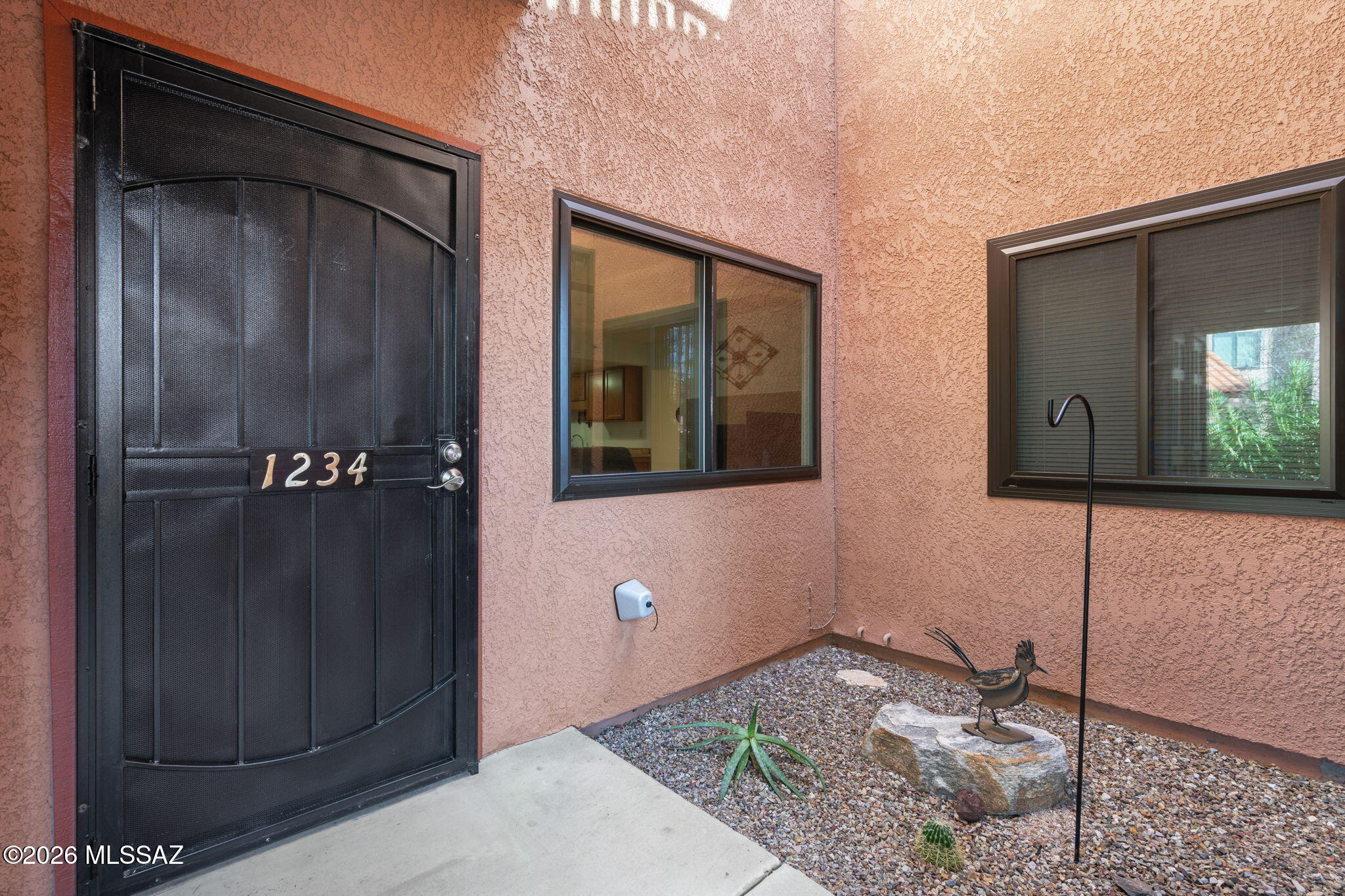 Desirable ground-floor unit! This private, inviting condo features numerous updates, including new windows, a new water heater, one updated HVAC unit, and additional improvements (see Documents tab for details). The HOA maintains the roof and recently completed routine maintenance, offering added peace of mind. HOA dues also include Rural/Metro Fire, structure insurance, water, roof, termite treatment, and trash for truly low-maintenance living. The unit offers a bright, open layout designed for everyday ease. It features a well-appointed kitchen that flows seamlessly into the dining and living areas, with generous natural light throughout. The primary suite provides a peaceful retreat with ample storage, while the guest bedroom offers flexibility for visitors or a work-from-home setup. Enjoy Tucson's beautiful desert evenings from the private patio. The unit backs to the West Spa. Community amenities include a grand clubhouse with a kitchen, exercise facilities, a game room, a heated pool, two spas, and tennis/pickleball courts - all set in the beauty of the Catalina Foothills. Convenient foothills location close to shopping, dining, and outdoor recreation. Comfortable, lock-and-leave living.