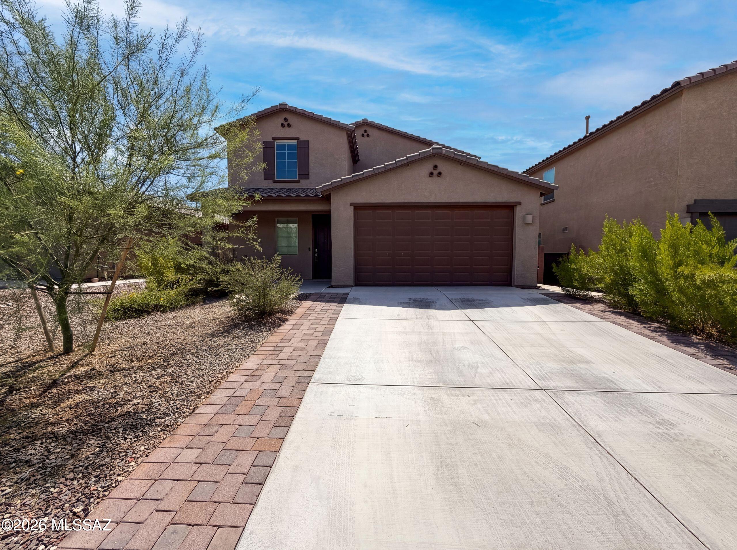 7904 S Bonanza Park Dr is a residence with a functional layout and modern finishes throughout. The home features a self-contained suite with its own entrance, living area, kitchenette, bedroom, and full bathroom, creating a versatile and independent living space within the residence. The main kitchen features a center island, stainless steel appliances, granite countertops, and a walk-in pantry, creating a fully equipped space for cooking and entertaining. The primary bedroom includes a walk-in closet for convenient storage and organization, while the primary bathroom features double sinks for everyday convenience. A patio extends the living space outdoors, creating ample room for relaxation and entertaining. This residence combines practical design with flexible living arrangements and.