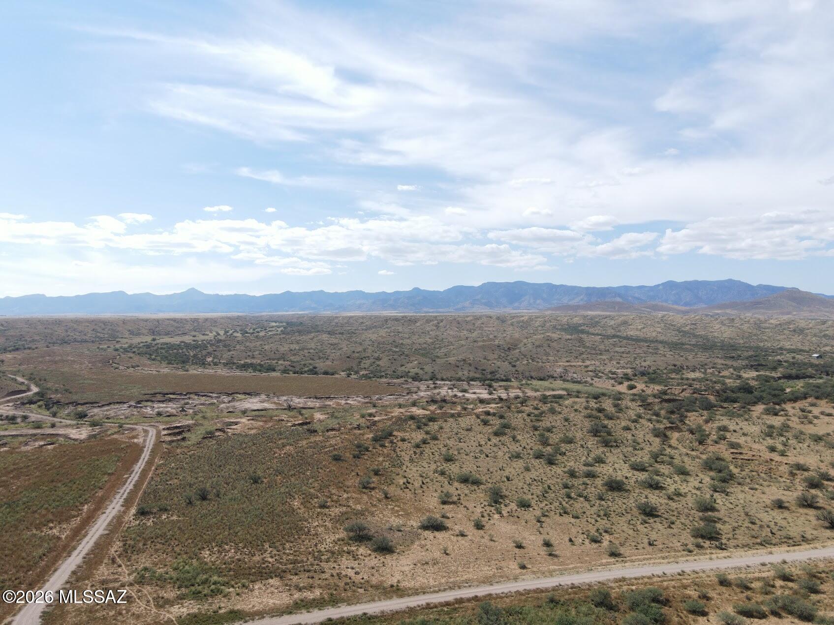 This is a wonderful 81.24 acre located toward the front east of the majestic Eureka Springs Ranch in Graham County Willcox, AZ This property has flat, hills and valleys with some dips and some fantastic panoramic views.  Some of the land is in a flood zone, which is around the Aravaipa Creek. Really must come out and drive the Ranch and around the property.  The North East corner of the property is located on the corner of S Warbonnet Rd, a large road off of the main Bonita Klondike Rd and S Warpaint Path and then the entire East side of the property runs along S Warpaint Rd.  There is plenty of areas to put a driveway to your new home location, just pick a spot and enjoy all that this lot and Ranch has to offer.