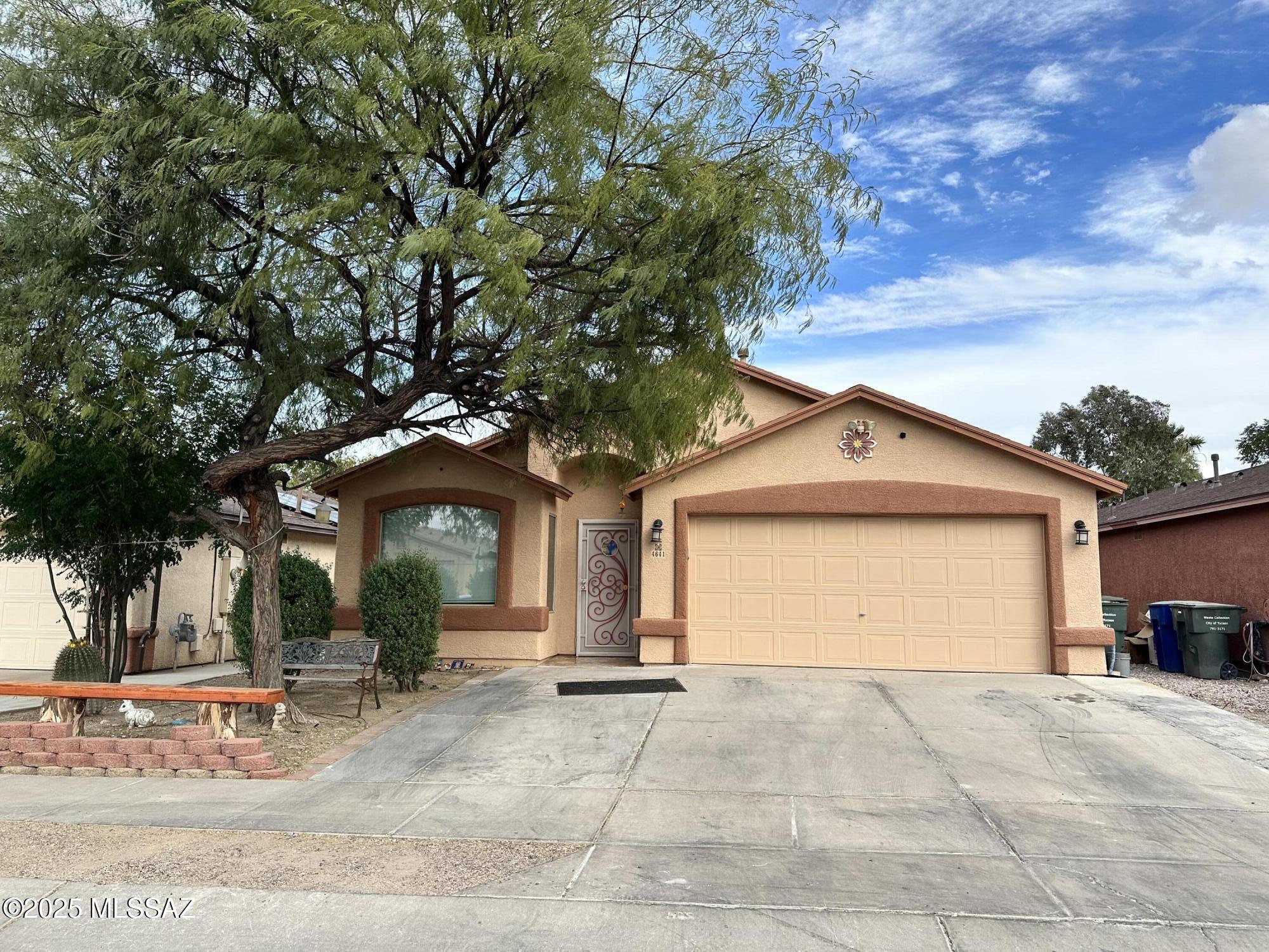 Step into your new home in southwest Tucson; this spacious 4 bedroom 2 bath has everything you need; the open floor plan features a kitchen center island that overlooks the dining and living room, rustic light fixtures and ceiling fans in most rooms. The primary suite features high ceilings and double bathroom' vanity; Own your own energy! The sellers will pay off solar panel balance at COE with a full price offer. Easy access to I-19 and I-10, Walking paths to river bank and services around the corner.