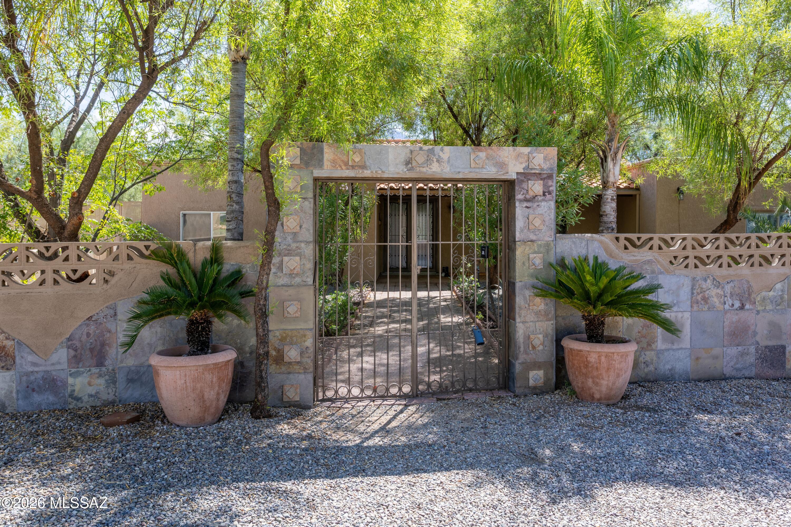 Enjoy breathtaking unobstructed mountain views and 1.34 acres ion Monte Del Oro neighborhood in Oro Valley. Single story home 3 bedrooms, 3 full baths a spacious living room, dining room, family room and a versatile bonus room ideal for crafts/office or hobbies. Has its own private full bath ideal for guests, children or a parent. Enjoy sparkling pool, outdoor kitchen plus plenty of room for toys, storage or additions. 1 car garage: second bay was enclosed for laundry room and could potentially be converted back. Comd and add your personal touch/upgrades.