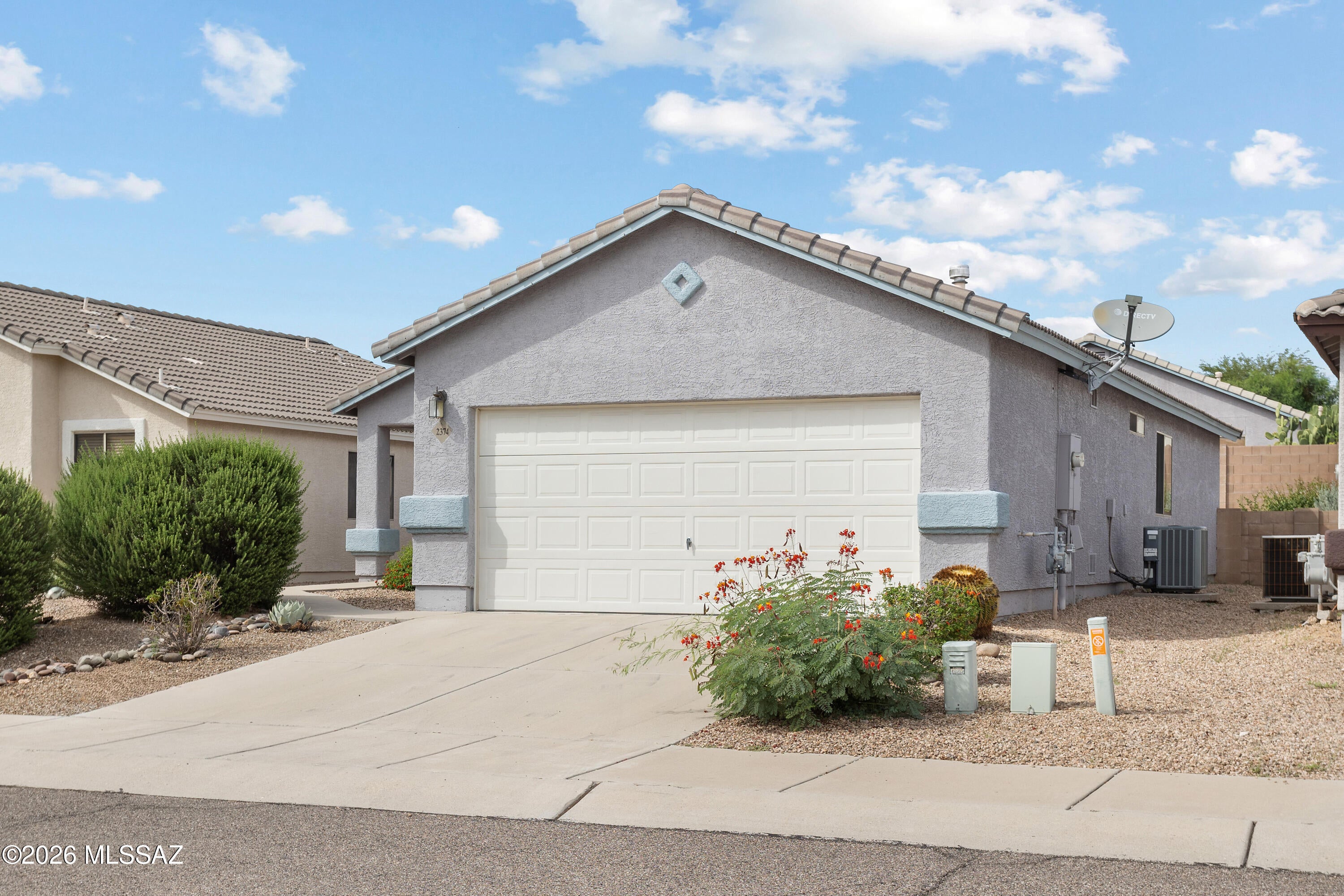 This charming, well-maintained 2-bedroom plus den, 2-bath home is tucked into a small, quiet enclave of homes in a highly sought after northwest Tucson location. Enjoy peekaboo-plus views of the Catalina Mountains to the east from outdoor living areas. The interior has been freshly painted in September 2026, creating a clean, move-in-ready feel. The kitchen features stainless steel appliances, with the refrigerator, washer and dryer included. Plantation shutters throughout, ceiling fans, tile flooring throughout, and a practical floor plan add to the home's comfort and functionality. The den provides flexible space for a home office, hobby room, or additional living area. Outside, the low-maintenance yard makes for easy living, while the covered back patio provides a comfortable spot to... relax and enjoy the outdoors. Conveniently located near shopping, a variety of restaurants, public transportation, the Northwest YMCA, dog park, golf, hospital/medical facilities, and Pima Community College. A great opportunity for buyers looking for a comfortable, low-maintenance home in a convenient northwest Tucson setting.