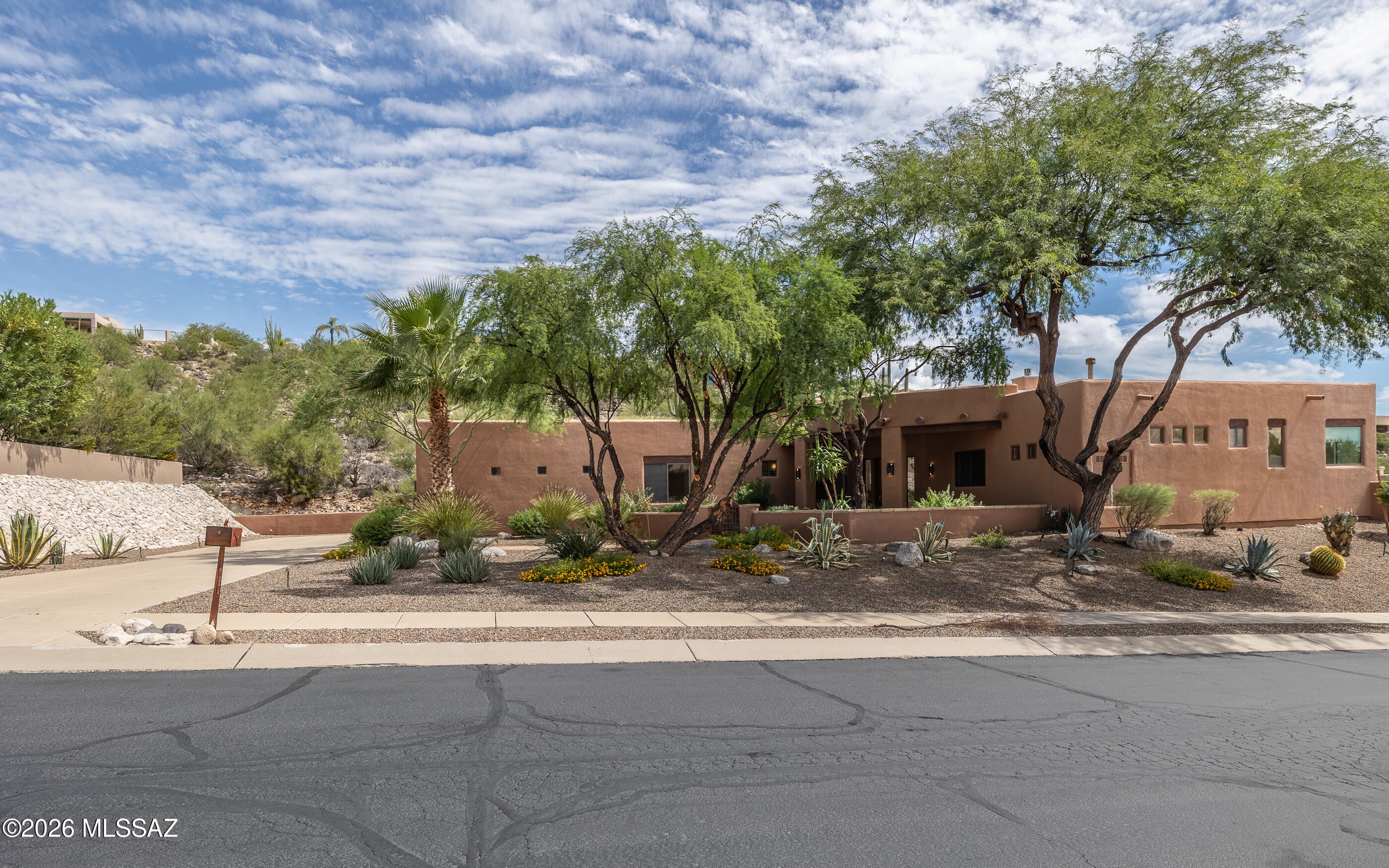 REMODELED 2021-2022. Lovely great room floorplan, custom cabinetry entertainment system-TV's convey. 3BRs plus LG. 14'8''x14' den & private 10'11''x10'5'' sitting room/library. Home bosts of 3 baths; powder room; plantation shutters; security; pool/spa solar coils for efficient heating; zoned HVACs & water heaters; 3 Gar; fabulous state of the art kithcen w/Samsung Frig; Red Wolf gas stove/oven; Avantium Oven/Microwave; Bosch DW; Brazilian Stone countertops w/leather finish; retractable mixer cabinet; super susan corner cabinet storage; under cabinet electrical strip w/2 charging ports at each end. Primary suite has stiing rm; large walk-in closet; heated bathroom floor; soaking tub; walk-in shower; bath vanities have auto built-in entry Sensor Lights(motion-activated) that provides soft g