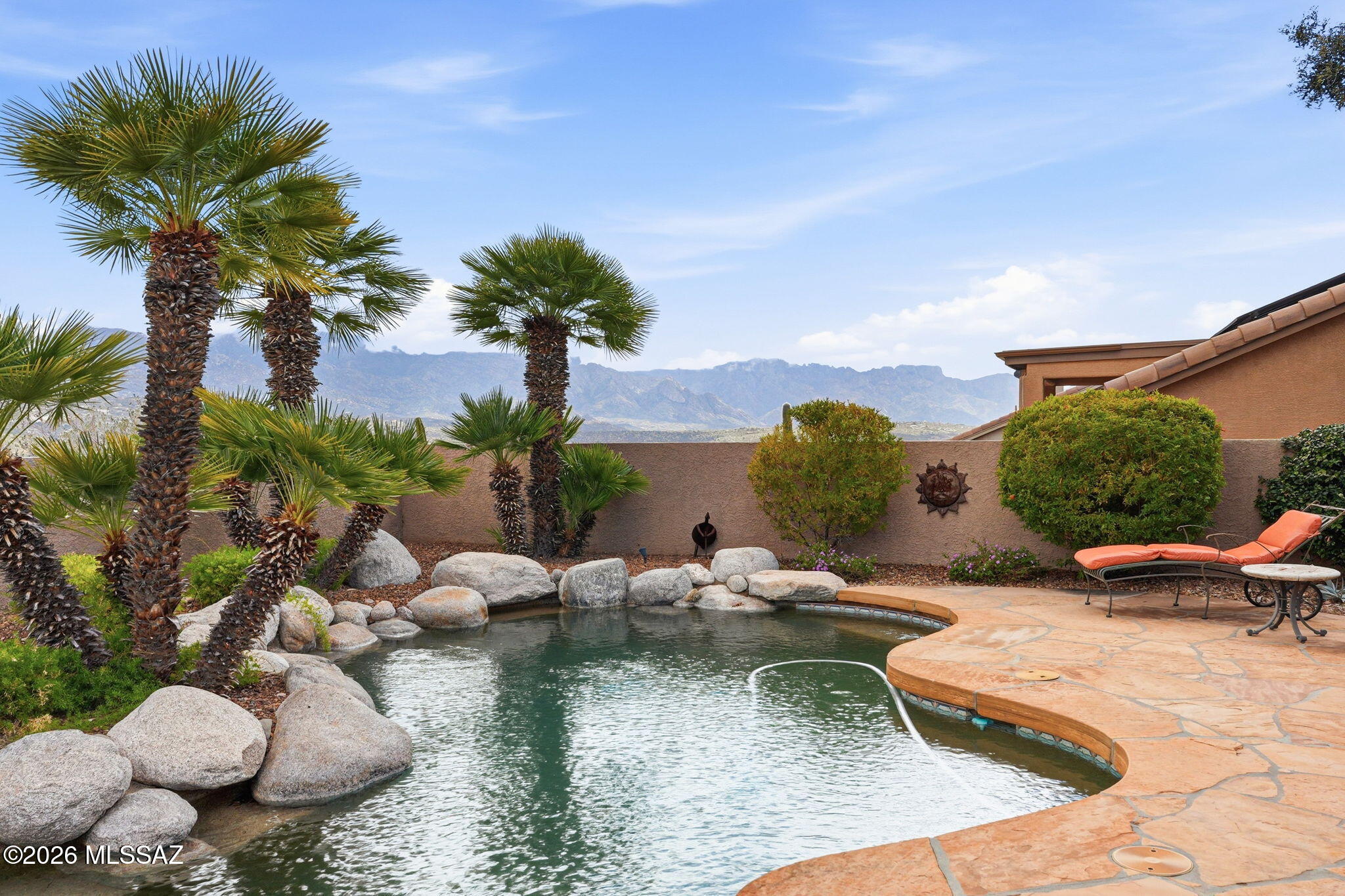 Stunning 180° panoramic Catalina Mountain views from the elevated east facing view lot! This 3 bedroom/2.5 bath Madera model features an office with built-ins, two living areas, and a very private backyard with Pebble Tec saltwater pool, solar heating, raised rose garden, and decorative boulders. Enjoy a full-length covered patio with flagstone flooring, ceiling fans, and electric sun shades.

Kitchen offers granite countertops, neutral tile flooring, GE induction cooktop, new dishwasher, microwave/oven combo, garden window, and breakfast bar. Beautifully remodeled primary bath. Built-in cabinets in living area, Berber carpet, and panel draperies. Oversized 2.5-car garage with built-in cabinetry, utility sink, and extra refrigerator/freezer. Newer HVAC and water heater. Roof regularly maintained. Exceptional view home with resort-style outdoor living.
