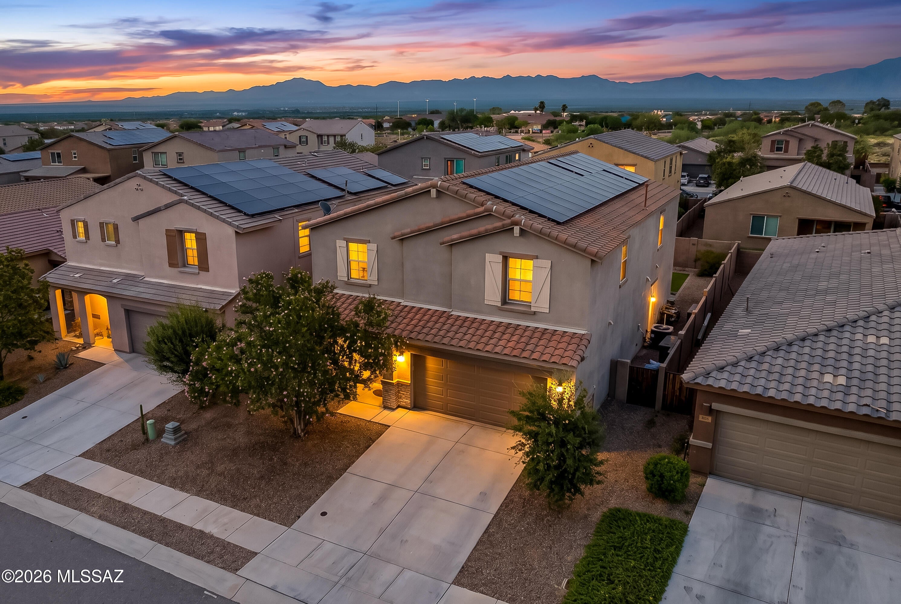 Modern design, thoughtful upgrades, and a truly move-in-ready feel make this 5-bedroom, 3.5-bath Verde floor plan one to see. Beautifully finished and ready for its next owner to make it home, the versatile layout includes a first-floor bedroom with a full bathroom, providing valuable flexibility for guests, a private workspace, or additional living needs.

At the heart of the home, the open kitchen brings style and function together with a generous quartz island, timeless marble backsplash, and brushed brass pendant lighting. Quartz countertops continue into the bathrooms alongside brushed brass faucets and light fixtures. A tiled accent behind the guest bathroom mirror adds a custom designer touch, while a wood accent wall creates warmth and character in the dining area.
- The backyard is already complete with artificial turf and pavers, giving you an attractive, low-maintenance outdoor space without waiting to finish landscaping after move-in. From the contemporary finishes to the completed outdoor areas, this is a home where much of the work has already been done. Bring your personal touches and start enjoying it from day one.

Located in Entrada Del Rio within Rancho Sahuarita, you'll have access to an impressive collection of community amenities, including multiple pools, fitness and recreation facilities, parks, playgrounds, lake access, community spaces, walking and biking trails, and year-round activities. The location also provides convenient access to I-19, making travel to Green Valley, Tucson, shopping, dining, employment centers, and everyday necessities easily accessible.

With five bedrooms, a main-level bedroom and full bath, designer-inspired finishes, a finished backyard, and the extensive amenities of Rancho Sahuarita, this turnkey home brings together comfort, style, convenience, and the Southern Arizona lifestyle.