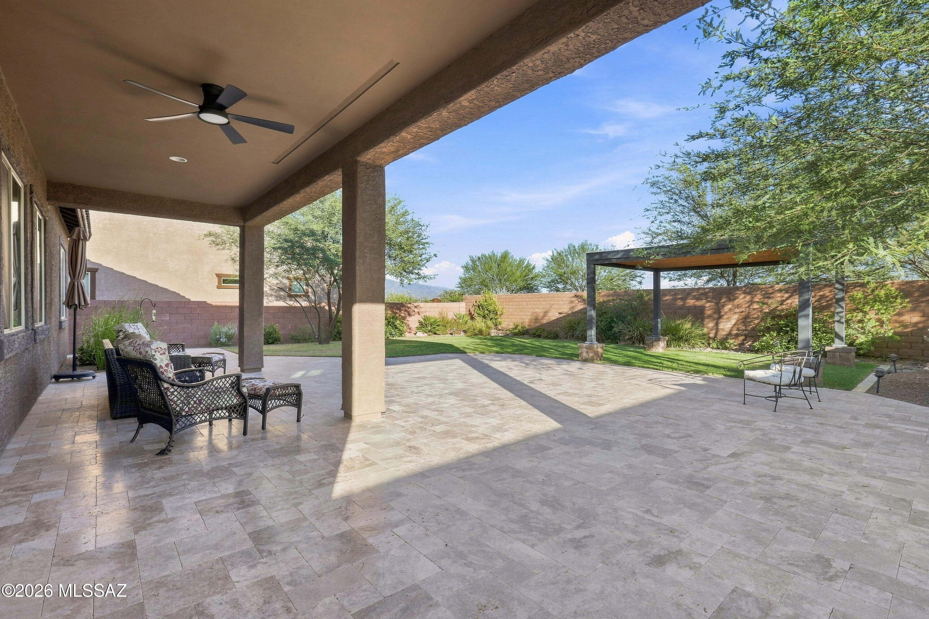Experience life in Rocking K Wildflower at its finest! *Range Priced: Sellers will consider offers between $510,000.-$525,000.*  Set on a premium cul-de-sac corner lot with only one adjoining neighbor, this light-filled 4-bedroom, 2-bath home offers exceptional privacy and beautiful mountain views from both the front and backyard. Located within the award-winning Vail School District's newest K-8 school area, this split floor plan is functional and inviting. The spacious kitchen is the heart of the home featuring granite countertops, a large island, stainless steel cooktop, wall oven, built-in microwave, and a side-by-side refrigerator. The serene primary suite includes two spacious walk-in closets, dual vanities, and a spa-inspired shower with dual rain and wall-mounted shower head. The oversized guest bathroom adds comfort for family and guests. The well-appointed laundry room includes extra cabinetry, there is also a soft water system, and an oversized garage providing ample storage. Step into your own private backyard retreat, enhanced by an extended privacy wall and beautifully landscaped with travertine pavers, lush grass, mature trees, and an electric-ready gazebo--creating the perfect setting for relaxing or entertaining. Enjoy parks, scenic trails, splash pad, and year-round community events that make Rocking K Wildflower an exceptional place to call home.