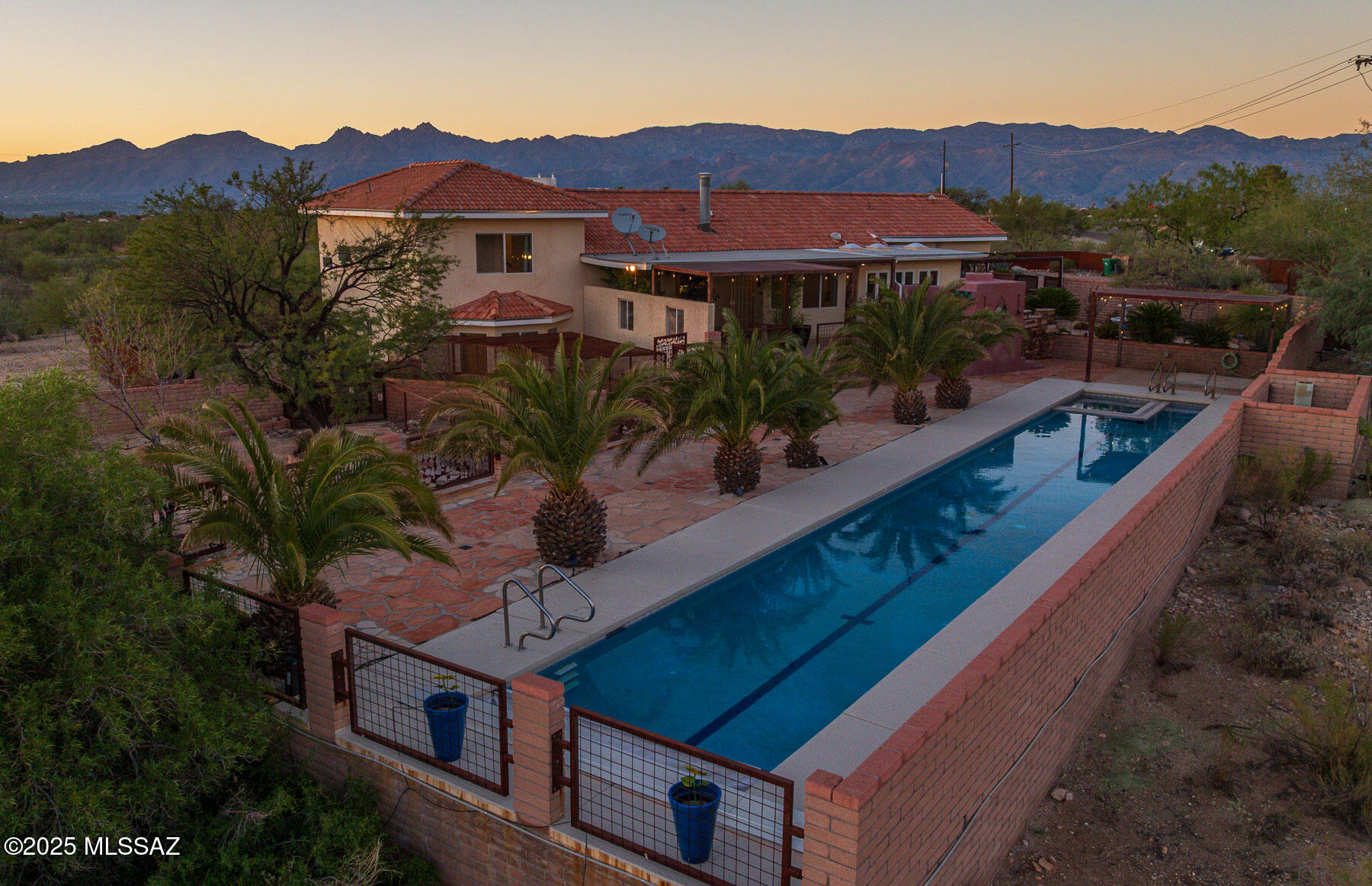 Seller will counter or accept offers between $799,000 and $825,000. Experience serene living in this stunning 3-bedroom, 3-bath home with 2 bonus rooms that can be used for office space, exercise room or how ever you see fit. The home sits on a 3.4 acres lot with 360° panoramic views, breathtaking sunrises and sunsets, and ultimate privacy. The spacious kitchen flows into open living areas, perfect for entertaining. Enjoy a full lap pool, relax by the fireplace on the back porch or unwind in the spa, enclosed with elegant metal fencing. A large 2-car garage offers ample storage. This property blends comfort, beauty, and functionality—your dream retreat awaits!