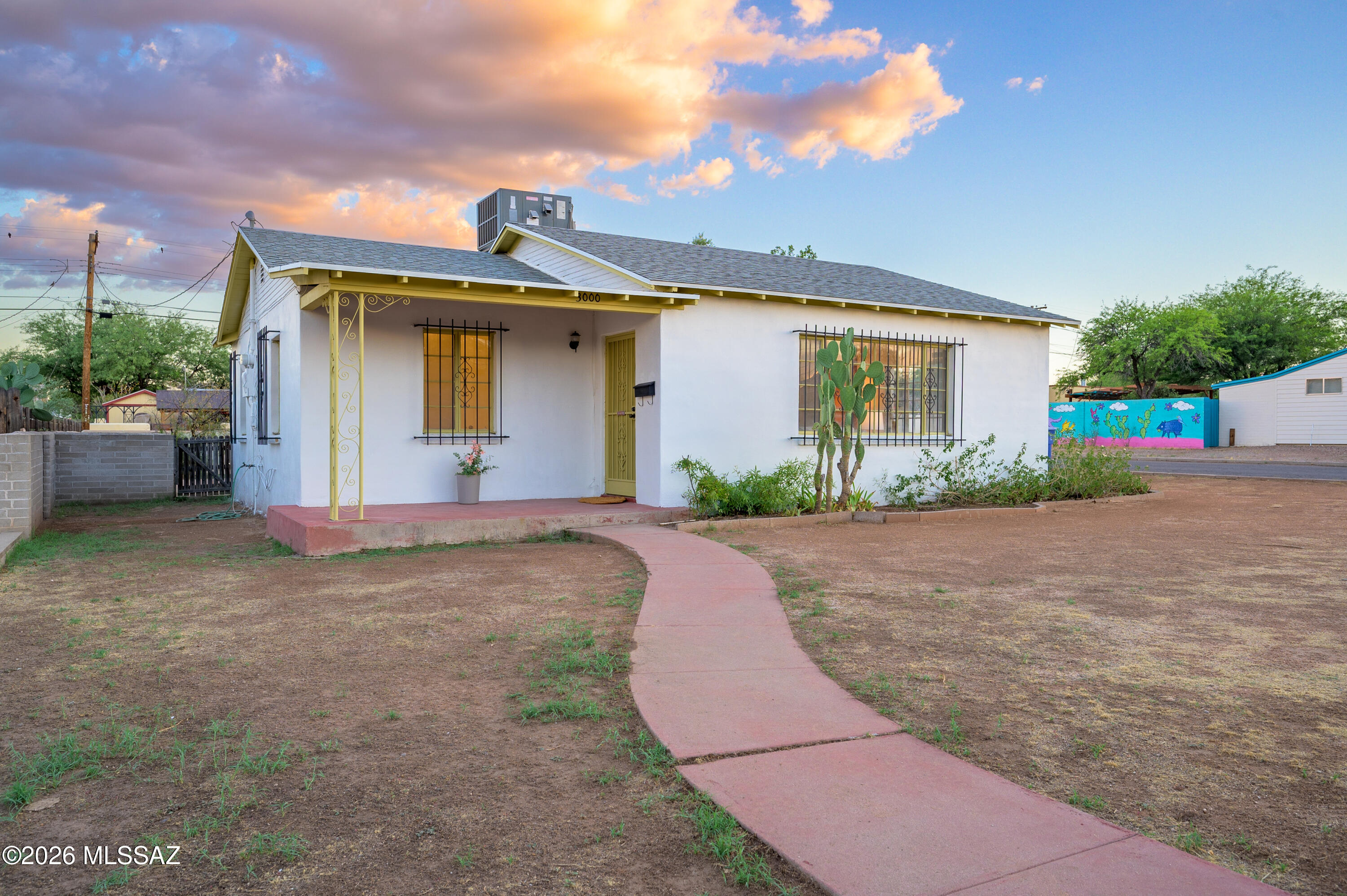 Charming 1949 Tucson bungalow on a low-traffic street -- 2 bed, 1 bath with major updates: NEW roof, newer HVAC. Also, updated interior plumbing piping. Sits on a huge corner lot with room to add an ADU for rental income, a guest house, or multigenerational living. Detached one-car garage provides indoor parking and storage. Interior features new carpet and fresh paint throughout (interior and exterior), offering a clean canvas ready for personalization. Unbeatable prime central location--minutes from major medical facilities and the University of Arizona--ideal for healthcare professionals, faculty, students, or investors. While the interior invites your updates, the value is in the solid bones and lot potential. Priced at $265,000. This home delivers instant equity opportunity in an unbeatable location. Don't miss this rare combination of affordability and prime positioning.