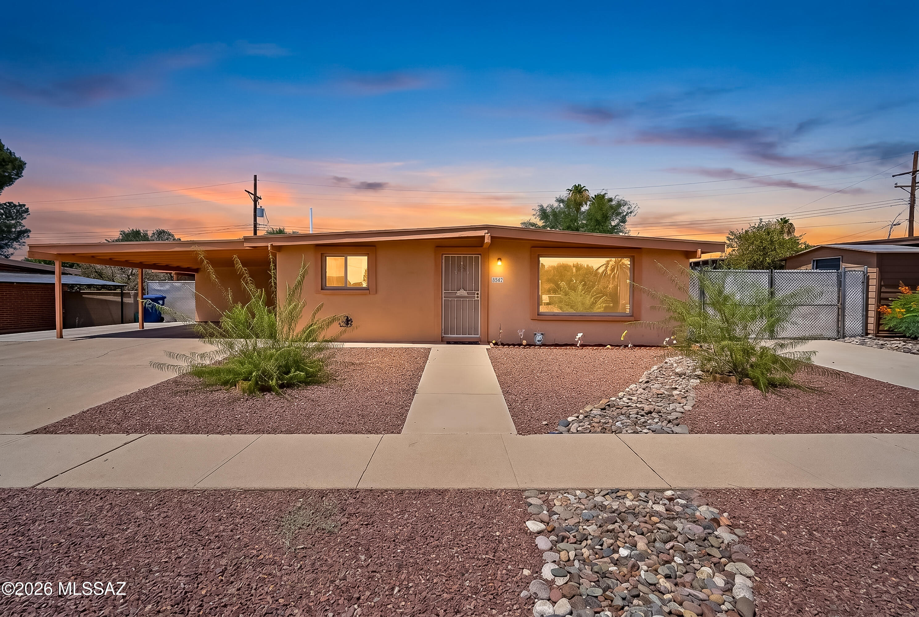 Lovingly maintained in Desert Steppes, this east side ranch home offers convenience, and low-maintenance living inside and out. Located just a short distance from Jesse Owens Park, this home features an open concept floor plan including a large, permitted bonus room that provides flexible space for a home office, hobby room, or additional living area, primary bedroom with ensuite bath, no carpeting throughout, hall bath with dual vanities. Roof warranty already in place, along with abundant storage throughout and all appliances convey. Generous carport and extra concrete pads along the side yards offer ample parking and utility space. Well paved roads throughout the neighborhood include designated bike paths. A well-cared-for property in a desirable location!