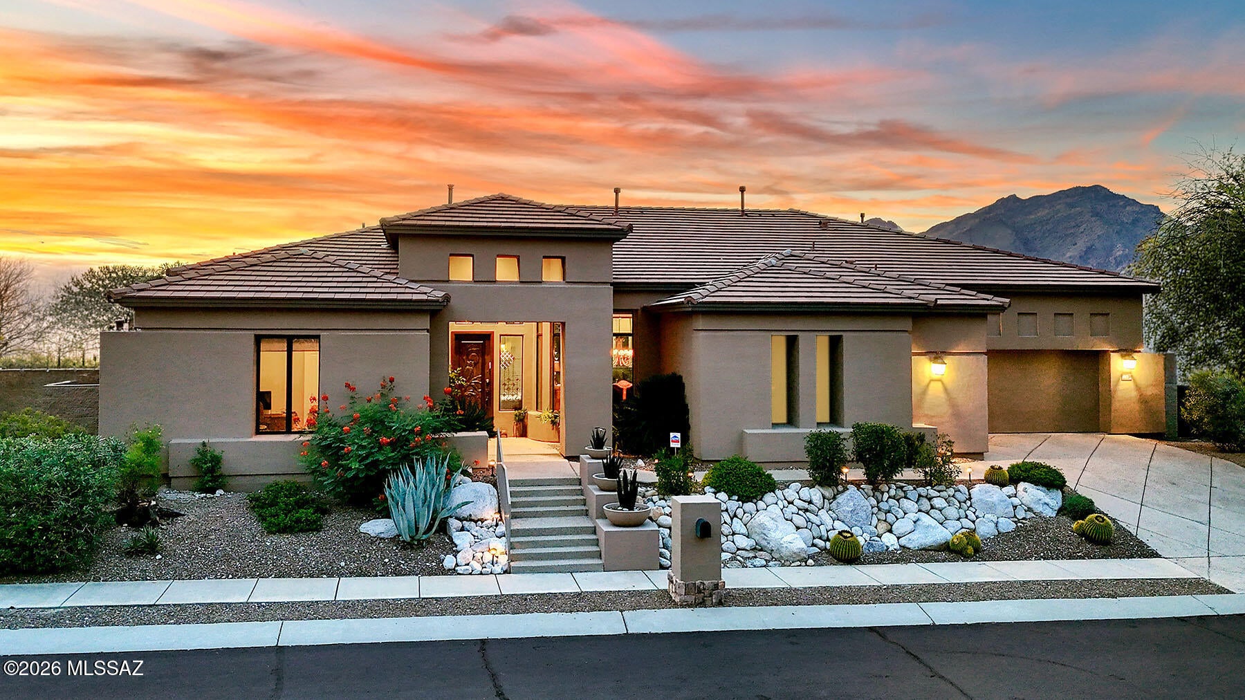 Sophisticated soft contemporary on top of a ridge with breathtaking city & mountain views in prestigious gated Sabino Mountain. Foyer entry, exquisite Great Room with gas fireplace, high ceilings, walls of windows to capture the views, 3485 sq ft., formal dining room, gourmet island kitchen with granite countertops, Alder cabinets, stainless steel appliances, 5 burner gas stovetop, double ovens, side by side refrigerator, extra prep sink, lovely breakfast area with views, beautiful tile floors, 3 bedrooms plus study with built in bookcases or 4th bedroom, 3.5 baths (each bedroom with its own bath) including primary suite with sitting area,
luxurious bath featuring granite countertops, double vanities, jetted tub, incredible shower, large walk-in closet, private entry to the rear patio ... ..... laundry room with washer, dryer, sink & abundant cabinets. Enjoy the fabulous backyard complete with covered flagstone patio, built in barbecue, motorized sun screen, lush vegetation, magnificent city, mountain & sunset views plus a 3 car garage, community pool, spa & rec center. Brand new $37,000 Roof! Picture perfect!