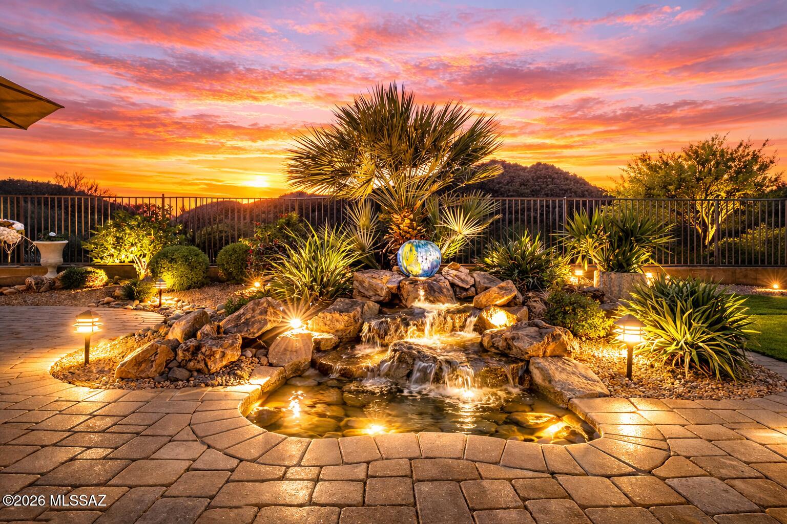 Imagine waking up to uninterrupted mountain views, hot air balloons floating against a Sonoran Desert sunrise, & the peaceful stillness that only a home backing to protected land can provide. Located in the gated, historic enclave of Lazy K Bar Ranch, this property offers the privacy & lifestyle today's relocation buyers are seeking -- space, serenity, and meaningful connection to nature. For executives, remote professionals, & multigenerational households relocating from higher-density markets, this 3,557 sq. ft. residence delivers flexibility & comfort with two private ensuites, expansive entertaining areas, & seamless indoor-outdoor living. The gourmet kitchen & extraordinary walk-in pantry elevate daily living, while the landscaped backyard with built-in barbecue & sunset terrace transforms evenings into experiences.
Bordering Saguaro National Park, you're not simply purchasing a home -- you're investing in a lifestyle defined by privacy, protected views, and the iconic beauty of Southern Arizona. All within reach of Tucson's conveniences, yet worlds away from congestion.