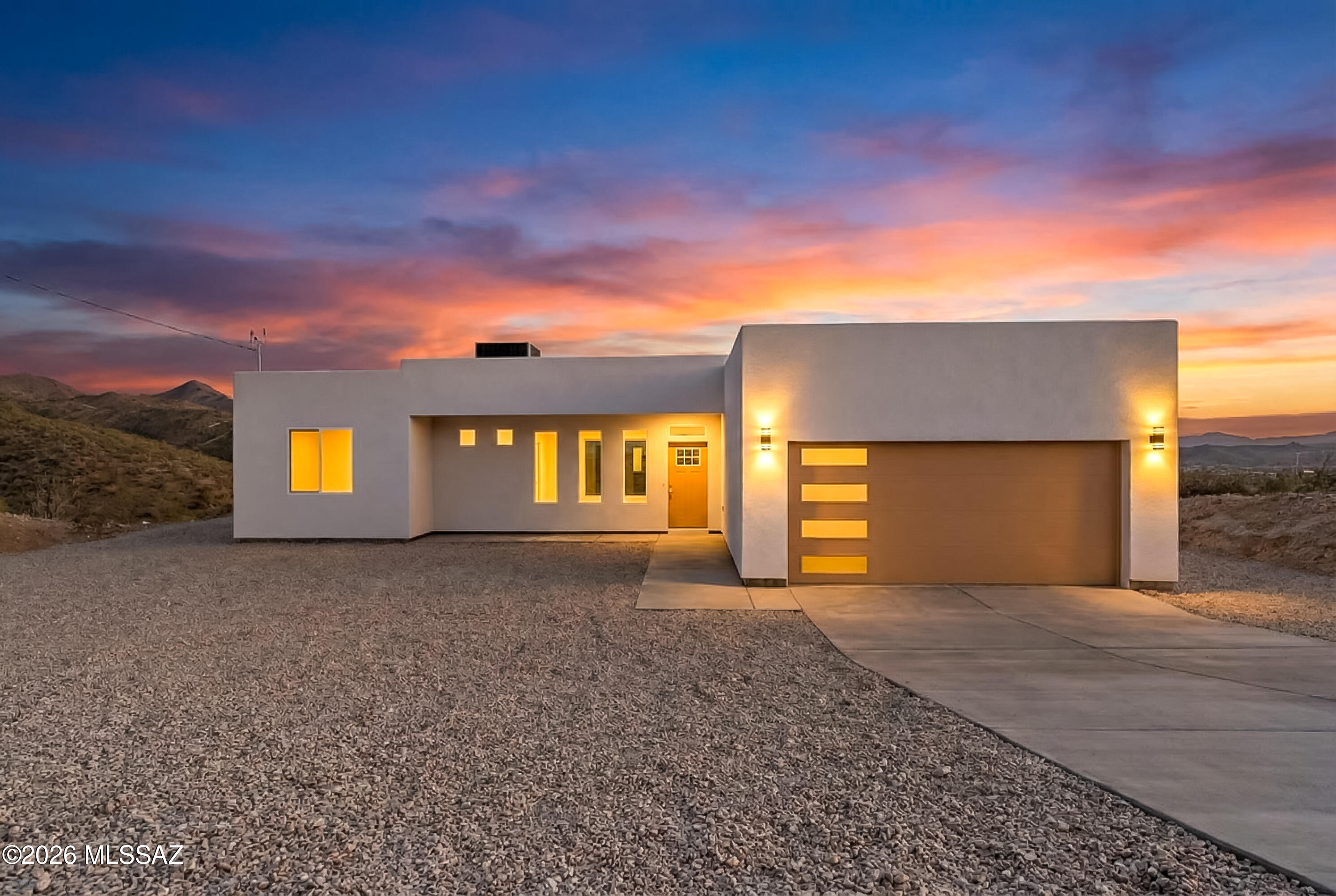 Experience Rio Rico, AZ living at its finest with this remarkable, brand-new construction home, featuring 3-bedrooms, 2 bathrooms, complete with a 2-car garage, nestled on a premium 0.57-acre lot with lovely mountain views. The views from this lot are stunning! As you approach the home, you'll be captivated by the breathtaking mountain views that greet you from the front yard, setting the stage for a tranquil lifestyle in the heart of nature's beauty. This charming Rio Rico home is more than just a house; it's an opportunity to embrace the beauty of the Arizona landscape. Schedule a showing to experience the allure of this Rio Rico gem. Don't miss your chance to make this property your new home.