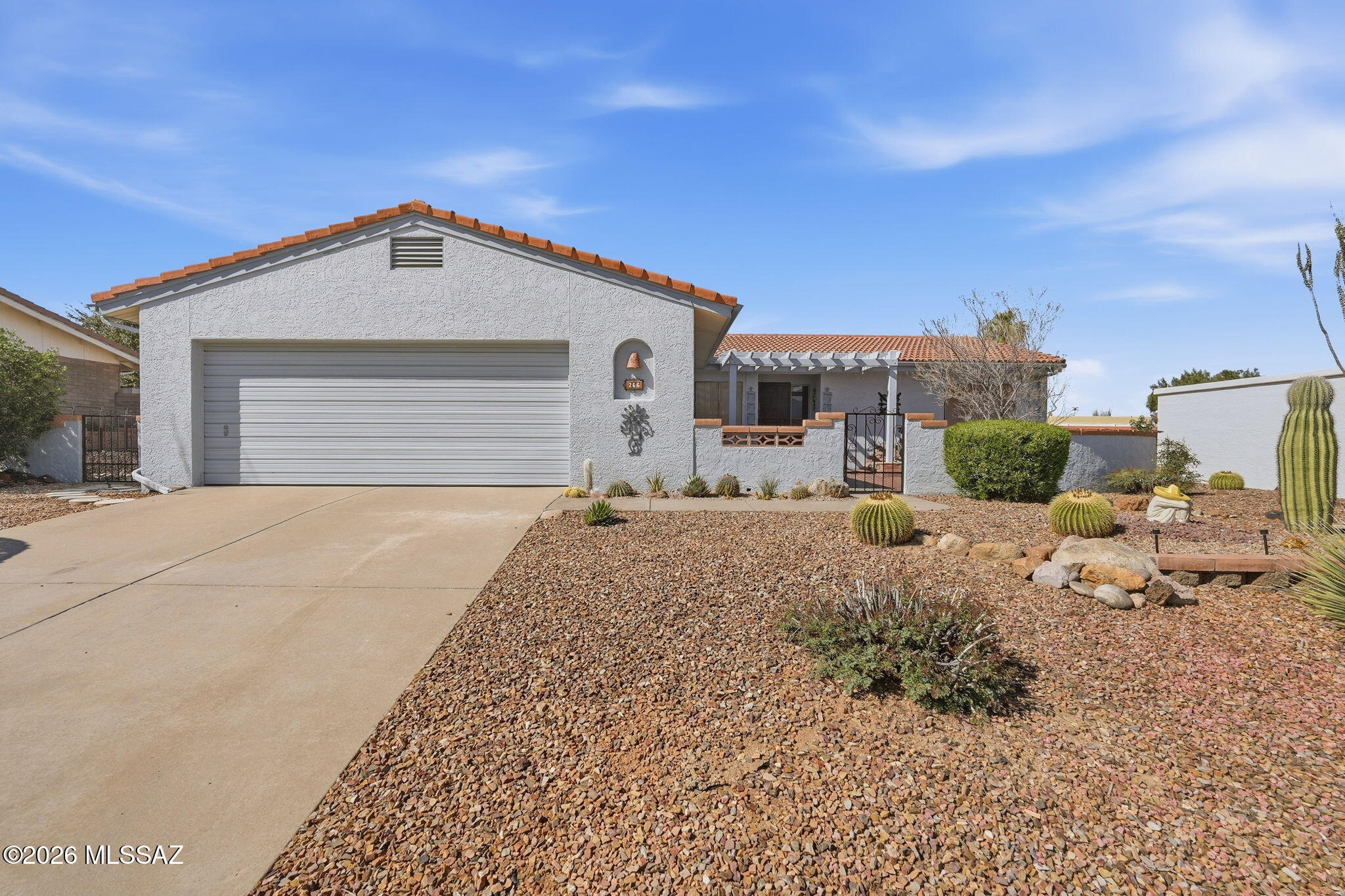 This beauty is in the desirable neighborhood of Country Club Vistas II. This centrally located neighborhood has a variety of custom homes, wide streets, sidewalks and a $3.00 a month HOA! Once you walk in the gated courtyard you are greeted with a fabulous mountain view and a water feature. This home has a large living room dining room combo, a kitchen that has newer appliances, 3 bedrooms and a bonus room which would be great for a office, craft room or a second living room. Owners have recently installed new Hunter Douglas blinds, a Pella sliding door and remodeled the guest bath. A beautiful back yard with a lovely garden, pergola and a mountain view are waiting for you!