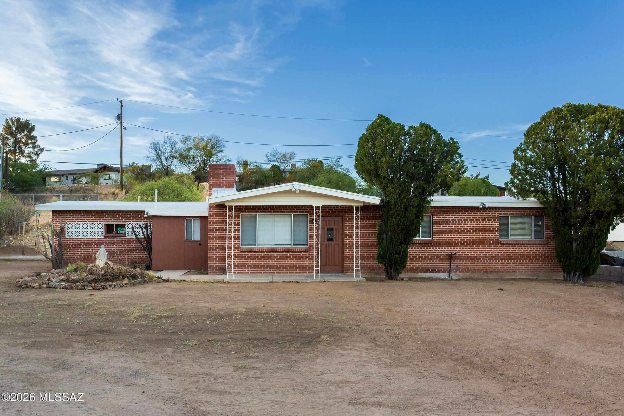 MOVE-IN READY RENTAL! Conveniently located with quick access to I-19 & close proximity to
downtown, shopping & the hospital. This charming 3 bdrm, 2 bth home is nestled up high in an established Nogales neighborhood. Fresh interior paint, window blinds, 2 fire places & ceramic tile flooring throughout. The backyard offers an extended covered patio & private courtyard with mature trees, shrubs & garden planters, creating a wonderful space for relaxing, entertaining & outdoor enjoyment. Monthly gardener service included.