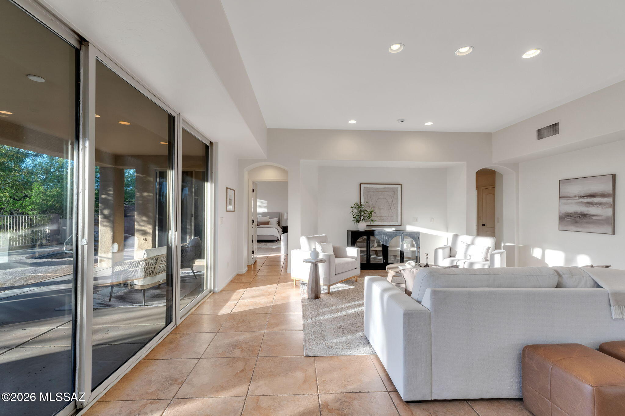 Nestled in the highly sought-after community of Dove Mountain, this beautifully maintained semi-custom residence offers the perfect blend of privacy, comfort, and timeless design. Proudly owned by the original homeowners, this home has been meticulously cared for and thoughtfully maintained throughout. Spanning approximately 2,333 square feet, this spacious floor plan features 3 bedrooms plus a versatile den, 3 full bathrooms, and a 2-car garage, providing flexibility for both everyday living and entertaining. From the moment you arrive, you are welcomed by a charming gated courtyard entry, setting the tone for the warmth and elegance found inside. The interior boasts tile flooring throughout, fresh interior paint, and a light-filled layout designed for effortless flow. At the heart of the home, you'll find a well-appointed living space that opens to a serene backyard retreat. Situated on a premium lot backing to open space, the property offers exceptional privacy and tranquility, with no rear neighbors. Step outside to your own private oasis featuring a spool (spa/pool combination)--perfect for relaxing on warm Arizona days or unwinding under the desert sky. Built by David Baird, known for quality craftsmanship and semi-custom design, this home reflects pride of ownership at every turn. A rare opportunity to own a private retreat in one of Northwest Tucson's most desirable communities--Dove Mountain living at its finest.