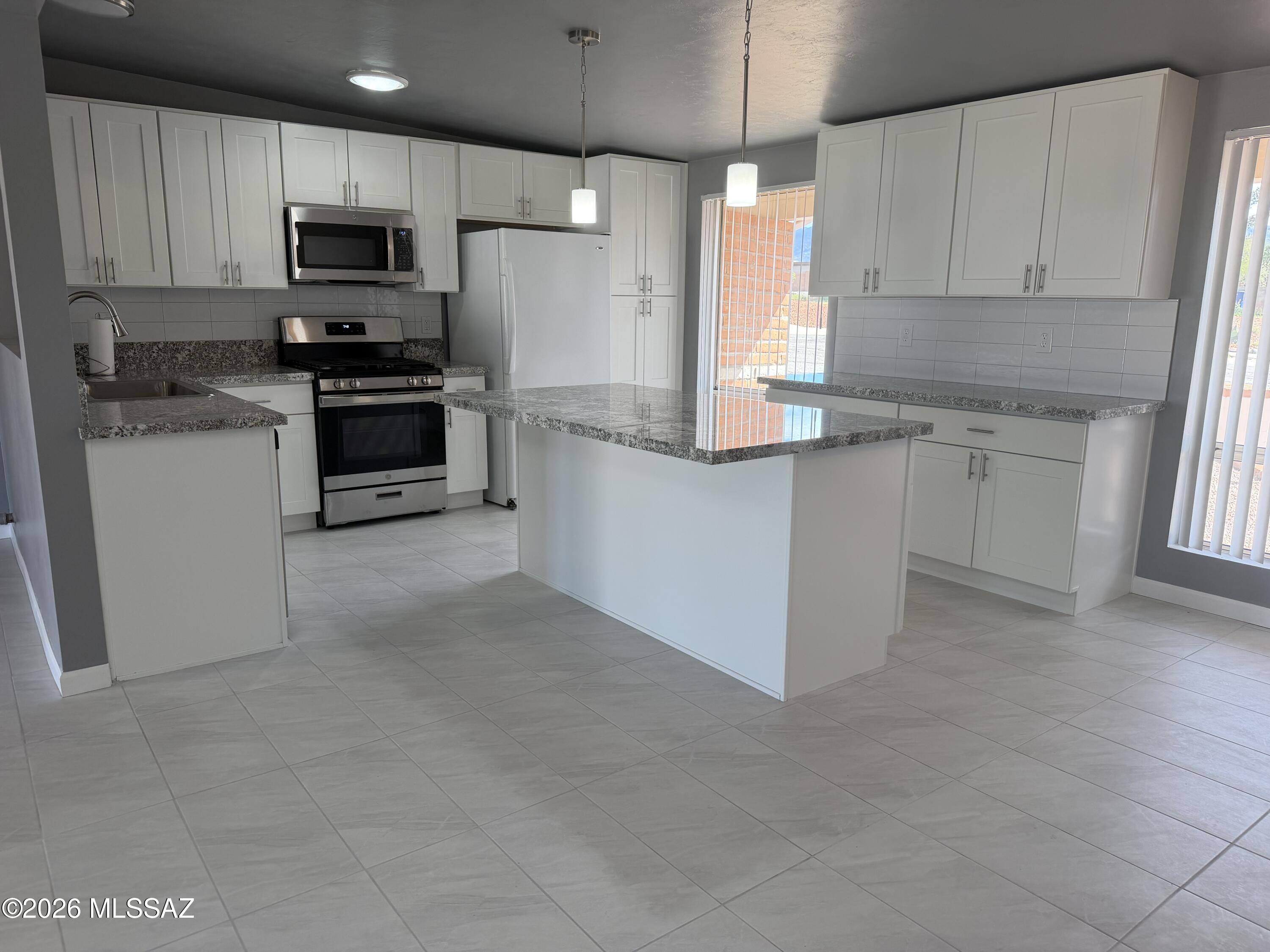 Welcome to this beautifully remodeled 4-bedroom home located on the desirable east side! Nestled in a quiet cul-de-sac, this property offers the perfect blend of comfort, style, and privacy. NEW FENCE in bk yard.
Step inside to discover a completely remodeled interior featuring a bright and airy open floor plan--ideal for both everyday living and entertaining. The spacious layout flows seamlessly from room to room, creating a modern and inviting atmosphere. Some new double-pane windows enhance energy efficiency while allowing plenty of natural light to fill the home. There is about 350 sq ft added to home Not included In assessor sq ft  laundry room is new. Area in front of kitchen & laundry rm & 4th bedroom is about 400 more sq ft that is not included in assessor. 
 Outside, you'll find a large backyard with stunning mountain views--perfect for relaxing evenings, weekend gatherings, or creating your dream outdoor oasis. Situated in a peaceful cul-de-sac, this home offers minimal traffic and added privacy.