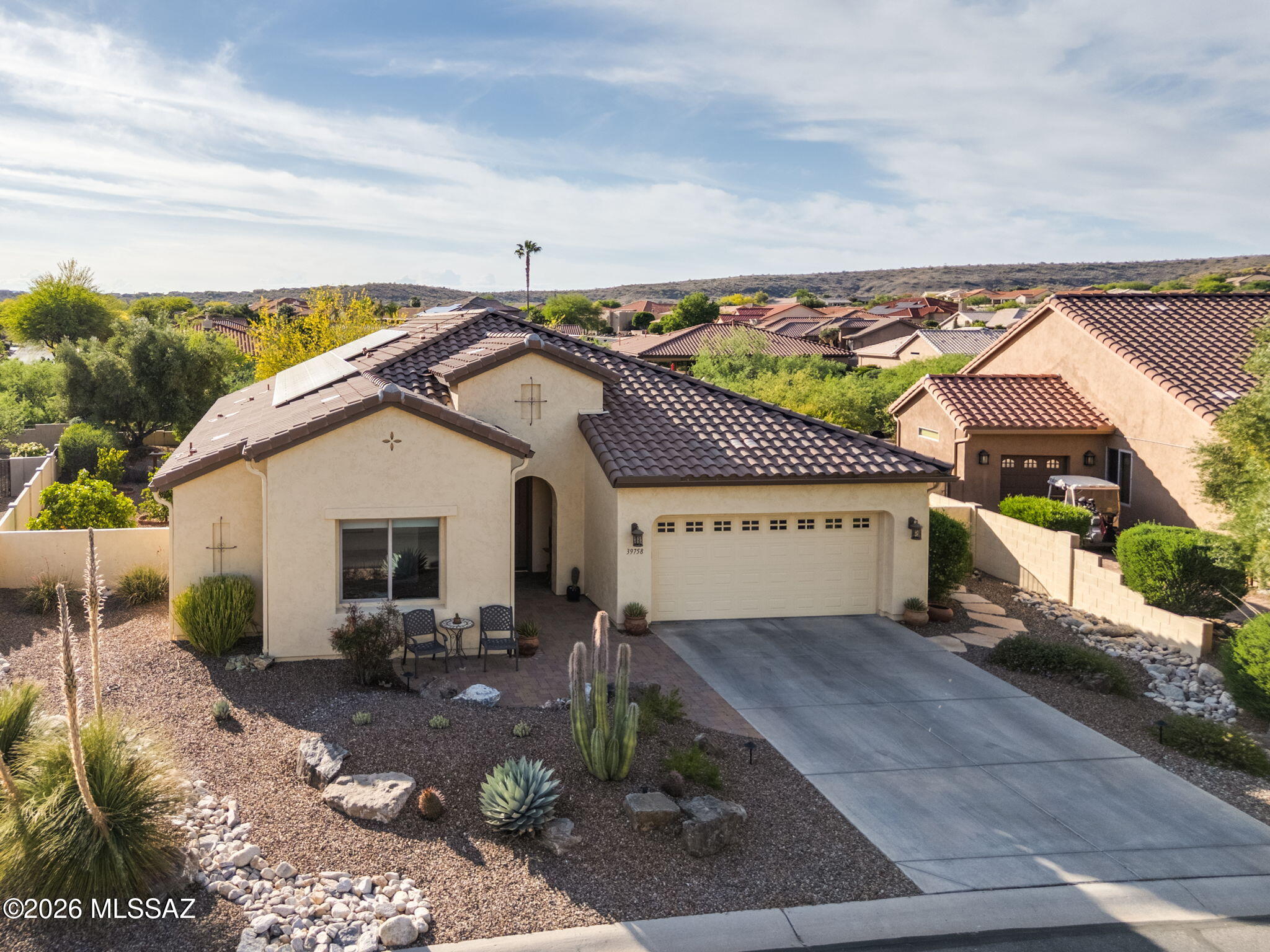 Located in the highly sought-after SaddleBrooke 55+ active adult community, this stunning 2,369 sq ft property offers the perfect blend of comfort, functionality, and Arizona lifestyle living. The main home features 2BD/2.5BA, plus a detached 1BD/1BA casita--ideal for guests, a private studio, or hobby space. Step inside to an inviting open-concept floor plan that seamlessly connects the living and dining areas to a chef's kitchen, complete with granite countertops, abundant cabinetry, and newer appliances, including an induction cooktop. The spacious owner's suite provides a relaxing retreat with a large walk-in closet and an oversized walk-in shower. A private guest room with ensuite bath ensures comfort and privacy for visitors, while the den--featuring custom built-in wall units--offer the perfect setup for a home office or library. Outdoors, enjoy a beautifully designed backyard with Audubon Society recognition for its professional landscaping. Take in stunning mountain views from the dedicated firepit lounge--perfect for relaxing evenings or entertaining guests. Additional highlights include owner-paid solar for energy efficiency and lower utility costs. Enjoy resort-style amenities including golf, swimming, dining, and a vibrant social scene.
