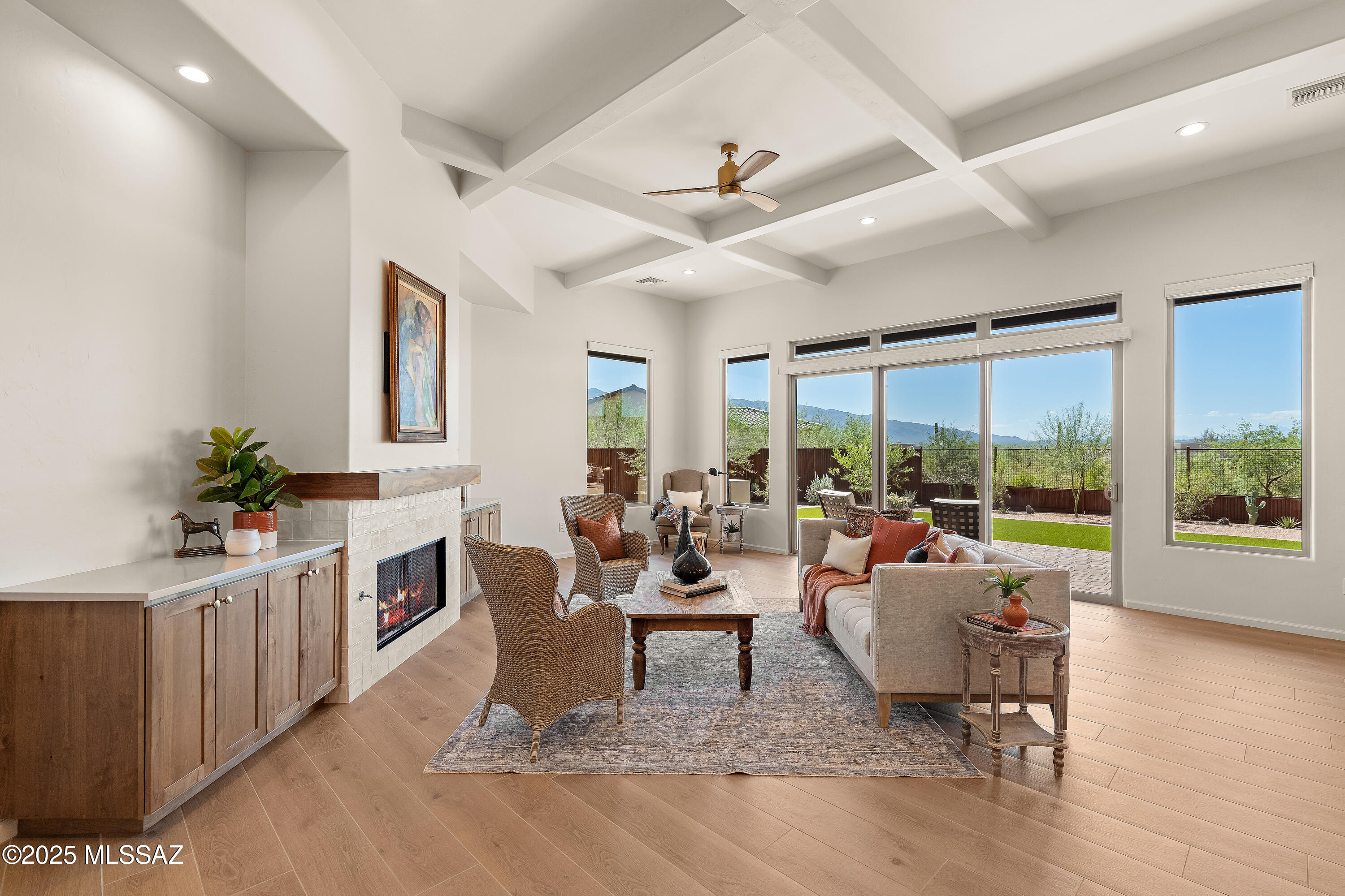 With views of the Rincon Mountains outside and luxurious finishes inside, this stunning Tanque Verde Valley residence awaits you. This impressive 4- bedroom, 3.5 bathroom single-family home in the gated Rancho Soldados community blends the serenity of our Sonoran Desert with the comfort and style of a truly custom home. The spacious layout features soaring ceilings, light-filled interiors, and a split floor plan for added privacy. In addition to the bedrooms, you'll find both an office and a bonus room, perfect for working from home or creating flexible living spaces. The gourmet kitchen is a true centerpiece, complete with a walk-in pantry, wine fridge and warm yet modern finishes. The primary suite is a retreat with a luxurious bathroom featuring a soaking tub, separate shower and dual vanities. Step outside to enjoy a beautifully designed backyard with artificial grass, custom fire pit, paver patios, and a handcrafted metal fence with trellis panels- ideal for both relaxing and entertaining. Situated on nearly an acre, the property also includes a 3-car garage, providing ample space for parking and storage. This home combines thoughtful design, functionality, and magnificent views to create the perfect retreat.