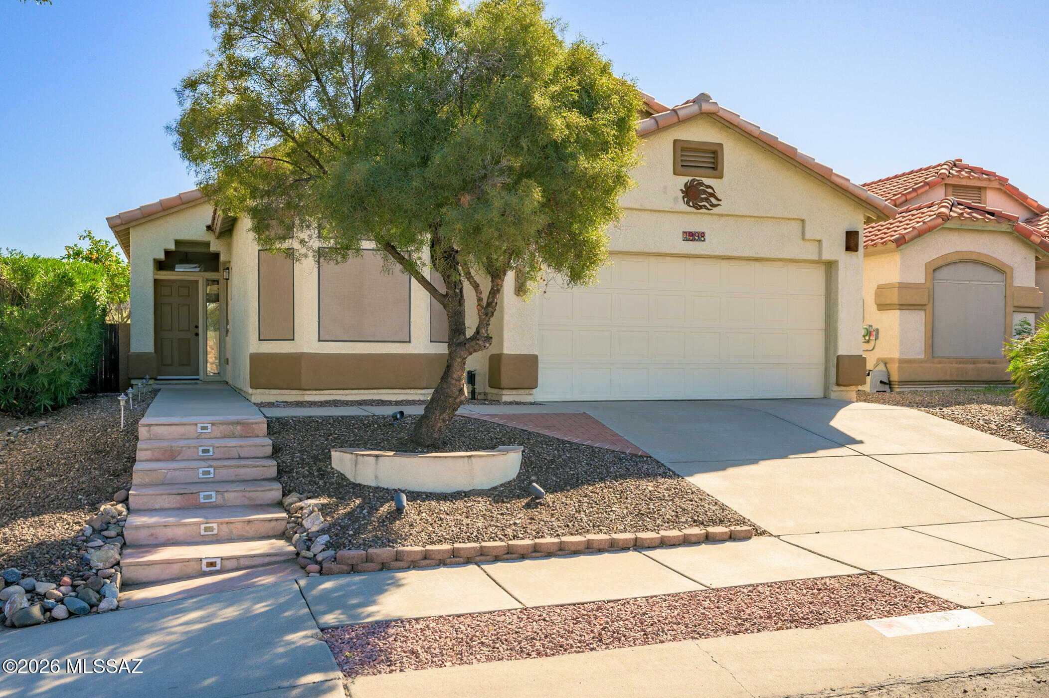 Great opportunity in Continental Ranch! Private, bright, and airy home with notable updates. This home is located on an elevated lot that backs up to a buffer zone offering a nice level of privacy. Featuring a split bedroom floor plan with four bedrooms/two bathrooms, this efficient floorplan creates versatile space suitable for various needs. The ceramic plank tile and neutral paint palette throughout compliment any style or decor. The open kitchen concept and generously sized living and dining areas simplify daily living. Just off the living area is the primary bedroom with an ensuite bathroom and separate toilet room. The spacious backyard boasts grass, irrigation system, fruit trees and a large, covered patio. Updates include a Trane HVAC system (2023) and hot water heater (2025). HOA amenities include access to two pools, spa & clubhouse. Convenient access to I-10, neighborhood parks, shopping, the Loop, & hiking trails. Don't miss out on one of the best values available in Continental Ranch!