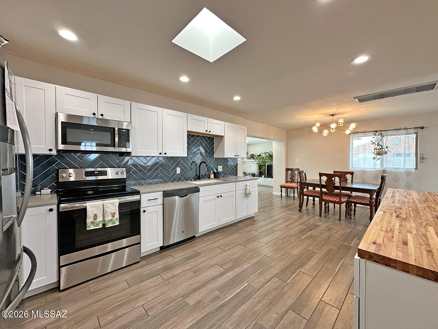 peaceful and beautifully updated 3-bedroom, 2-bath home offers a bright open floor plan with contemporary finishes throughout. The spacious kitchen flows seamlessly into the living and dining areas, creating a perfect space for everyday living and entertaining. Bathrooms have been tastefully renovated, and durable ceramic flooring runs throughout the home. The Primary Bedroom has a generous walk-in closet with adjustable heavy-duty shelving, with enough capacity to make organizing easy.
Private, fully walled backyard with abundant storage space, features a deep pool and a large covered patio. A sliding front carport gate provides added privacy and convenience.