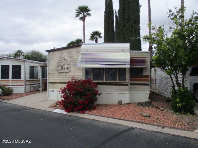 Affordable 1BD/1BA home in the desirable Western Way RV Resort, a 55+ community offering low-maintenance living and great amenities. This 442 sq ft manufactured home features a bright living room, dining area, laminate flooring, electric range, stacked laundry space, and heat-pump heating/cooling. Enjoy a covered deck and low-care landscaping on a quiet paved street. Community perks include pool, spa, rec center, pickleball, billiards, library, craft room, and exercise facilities.