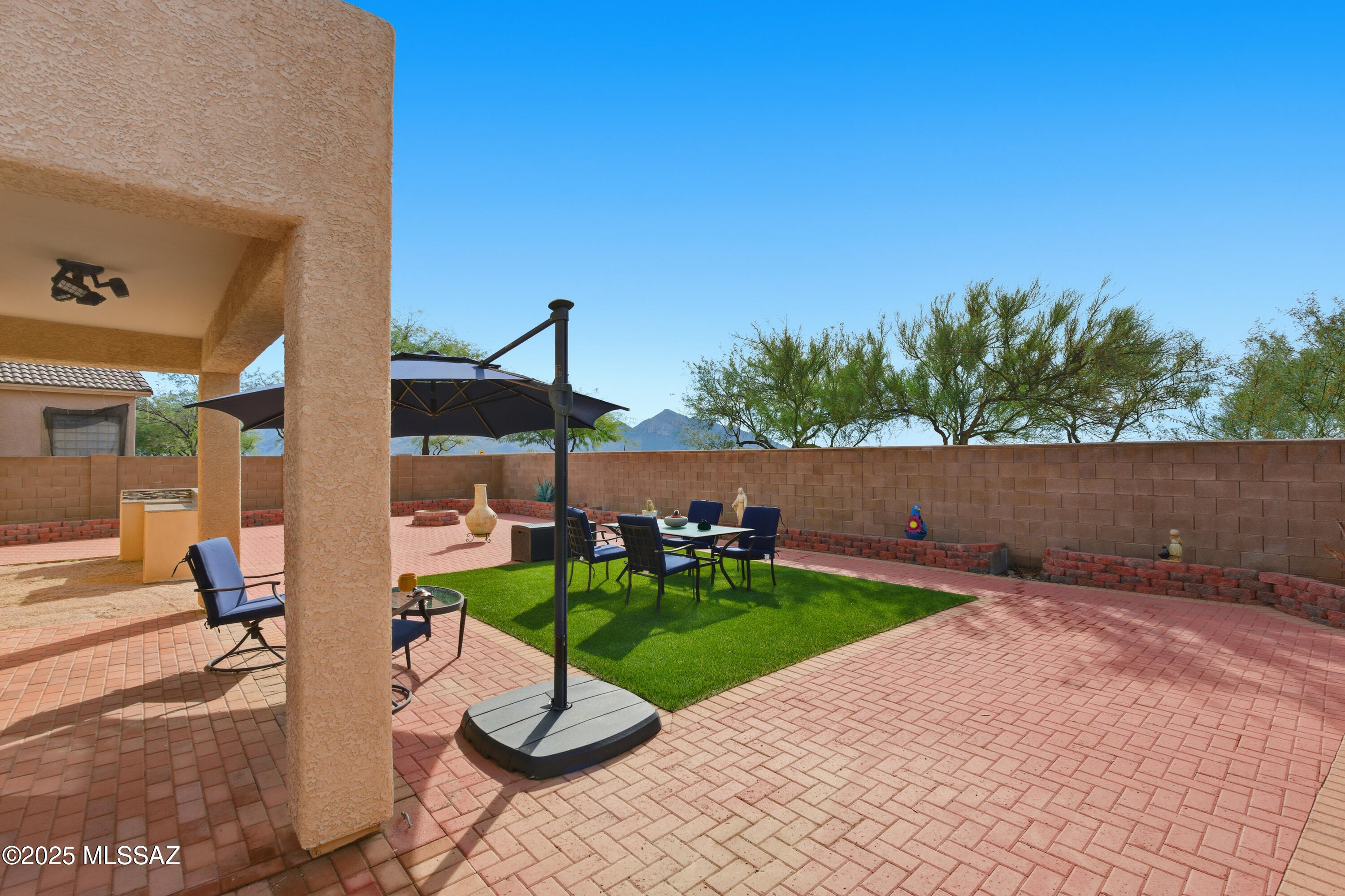 NEW PRICE - So hurry over! 🎉. A True ORO VALLEY show stopper where breathtaking mountain views elevate everyday living. Thoughtfully designed and beautifully maintained, it shines inside and out. Enjoy a custom-landscaped backyard that feels like a private retreat--perfect for sunset relaxation or entertaining. Inside are three spacious bedrooms plus a large loft ideal for an office, game room, or cozy escape. The main level features a sleek, no-carpet design for a clean, modern feel. The gourmet kitchen steals the show with granite countertops, a brand-new gas range, designer flat-front refrigerator, and a huge walk-in pantry. A rare 2.5-car garage tops it all off. This home truly checks every box - don't miss it!
