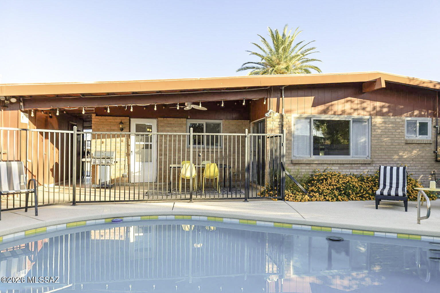 Mid-Century meets modern comfort in this updated Tucson home with sparkling pool! The open floor plan with 3 bedrooms & 2 baths features spacious living areas and a classic kitchen with warm wood cabinetry, stainless appliances, and plenty of counter space. The primary suite includes a remodeled bath with dual vanities and a walk-in shower. Enjoy the private backyard with pool surrounded by mature landscaping and covered patio. A detached multi-purpose room off the carport offers space for games, projects or more. HVAC recently updated, LVT flooring, and pool updates: pump, plaster, and more. Located near parks, shopping, and dining in the east side of Tucson. Furnishings and housewares are available for a real turn key home! Seller is a licensed real estate agent.