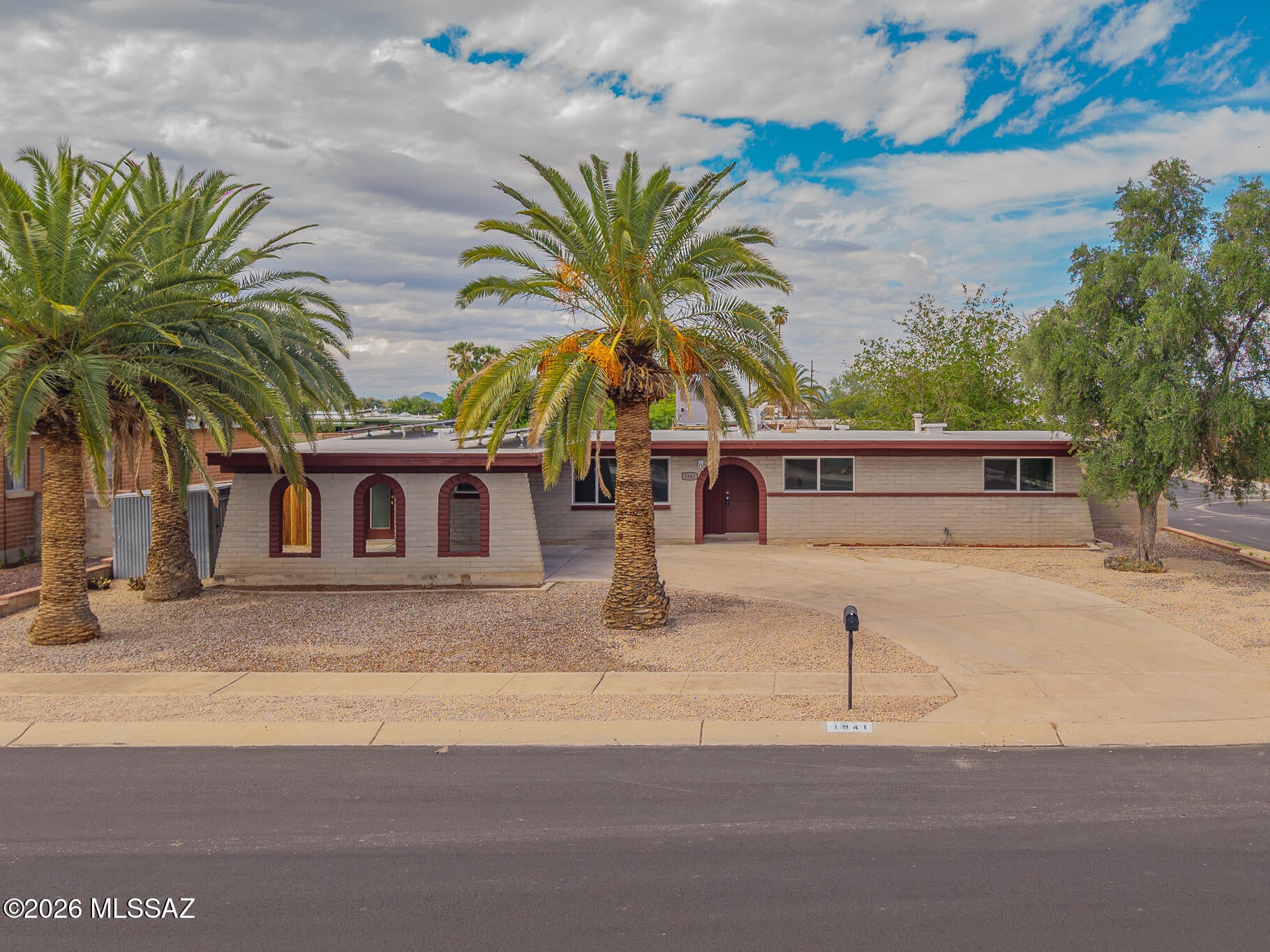 Seller to accept or counter offers between $379,900 - $394,900. Remodeled 4-bed, 2-bath split floor plan with two living areas. The open kitchen features modern cabinets, granite counters, and new appliances, flowing into the dining area and sitting room. Separate laundry room off the kitchen. Primary bedroom with its own bath, plus a fourth bedroom on the opposite side of the home, ideal for guests or an office. New LVP flooring, new carpet in bedrooms, new tile showers, and fresh paint throughout. Large covered back patio, side patio, and carport. Central-east Tucson, near shopping, dining, and major routes. Move-in ready.