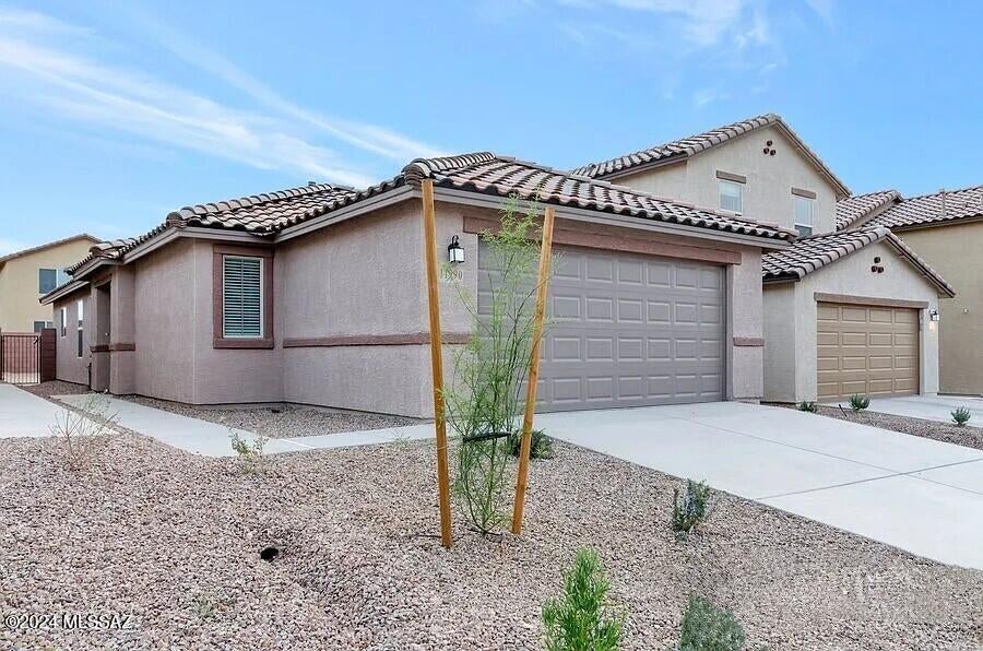 New community and newer home, available now! This single-story home features a covered back patio and upgraded wood-look porcelain tile flooring in all the common areas. The gourmet kitchen showcases dark brown birch cabinets, granite countertops, a peninsula, pantry, and Whirlpool(r) stainless steel appliances. The primary suite boasts a walk-in closet, shower, and dual-sink vanity. Bedroom 2 includes a walk-in closet. Tenant occupied until 09/30/26
