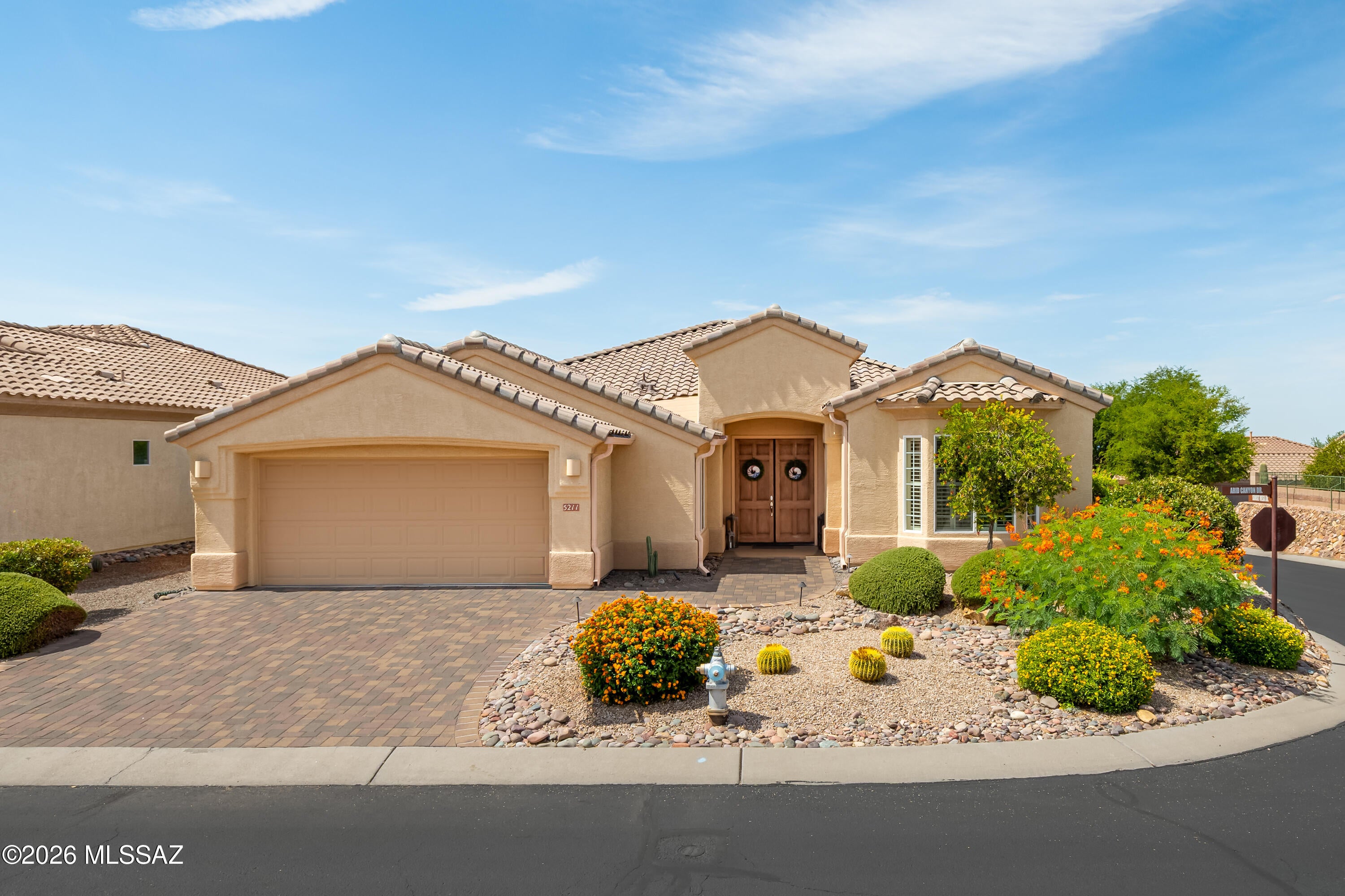 Resort-Style Living in The Highlands at Dove Mountain! Nestled on a desirable corner lot within this premier gated 55+ active adult community, this spacious 2,461-square-foot home offers the perfect combination of comfort, elegance, and modern updates. Featuring 3 bedrooms, 2 beautifully remodeled bathrooms, and a versatile den/flex room, this thoughtfully designed floor plan provides ample space for everyday living and entertaining.
The remodeled primary suite is a true retreat, featuring a stunning level-entry accessible shower with dual shower heads, while the guest bathroom has also been tastefully updated. The well-appointed kitchen is equipped with a gas cooktop, double ovens, abundant cabinetry, and opens seamlessly to the living areas highlighted by a cozy fireplace with a strikin granite tile surround. Plantation shutters throughout the home add timeless style and energy efficiency.
Step outside through the French doors to enjoy Arizona's year-round sunshine on the expanded paver patio, complete with convenient rolling shades for added comfort. Additional upgrades include a new roof (2026), new garage door opener, widened paver driveway, golf cart garage bump-out, new Culligan water softener, Toto toilets, and numerous quality improvements that make this home truly move-in ready.
Living in The Highlands at Dove Mountain means enjoying an unmatched active lifestyle with an 18-hole championship golf course, driving range, putting course, pickleball and tennis courts, resort-style pool and spa, state-of-the-art fitness center with classes, and a newly expanded arts and crafts center offering creative spaces and activities. Whether you're golfing, staying active, exploring new hobbies, or simply relaxing with neighbors, you'll love the vibrant lifestyle this community has to offer.
Some furnishings are available for purchase on a separate bill of sale, making this an exceptional opportunity to begin enjoying everything The Highlands at Dove Mountain has to offer from day one.