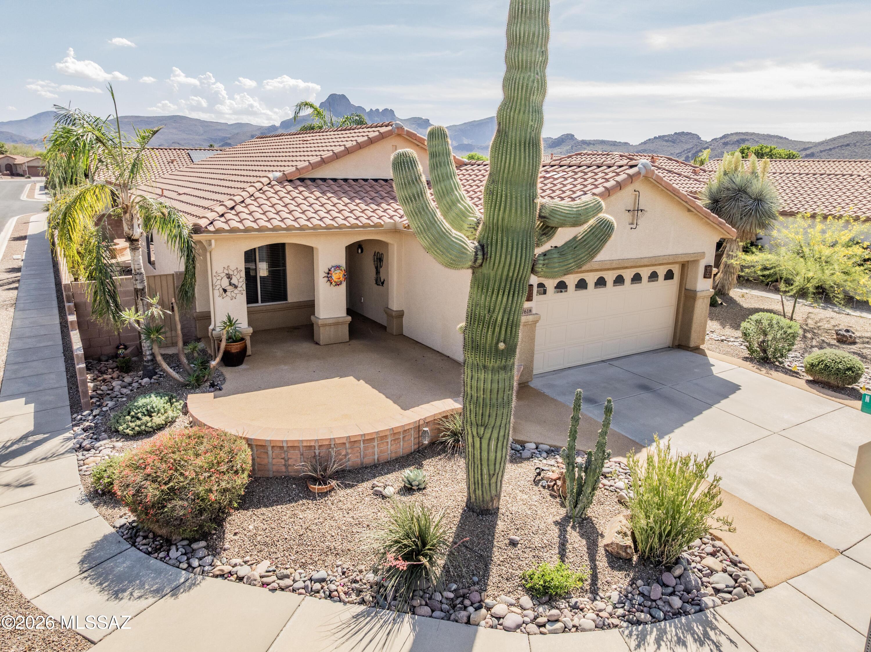 Arrive to effortless desert elegance in this immaculate Sierra model, where timeless
design meets everyday comfort. A charming flagstone courtyard sets the tone, welcoming you into a beautifully maintained home that feels both refined and inviting. Inside, the great room layout flows seamlessly, anchored by a formal dining space and a bright eat-in kitchen designed for all. Rich maple cabinetry with crown molding, Corian
countertops, and a detailed ceramic backsplash create a polished, upscale feel. The primary suite is a serene retreat, featuring a bay window sitting area and a well- appointed en-suite with dual vanities and a spacious shower. Thoughtful upgrades elevate the entire home such as plantation shutters, 16'' ceramic tile throughout (no carpet), rain gutters, and an extended garage for added convenience. A custom Murphy
bed adds flexibility to the guest space, perfect for hosting with ease. Outdoors, the private backyard is made for Arizona living, with mature landscaping, a covered patio, and an extended flagstone entertaining area ideal for relaxing evenings or hosting under the desert sky. Located in the sought-after Del Webb Sunflower community, residents enjoy resort-style amenities including a state-of-the-art fitness center, heated pool and
spa, lighted tennis courts, and an active clubhouse with endless social opportunities. From morning coffee in the courtyard to sunset gatherings in your backyard, this home delivers the lifestyle you've been waiting for just moments from the community center and everything that makes Sunflower so special.