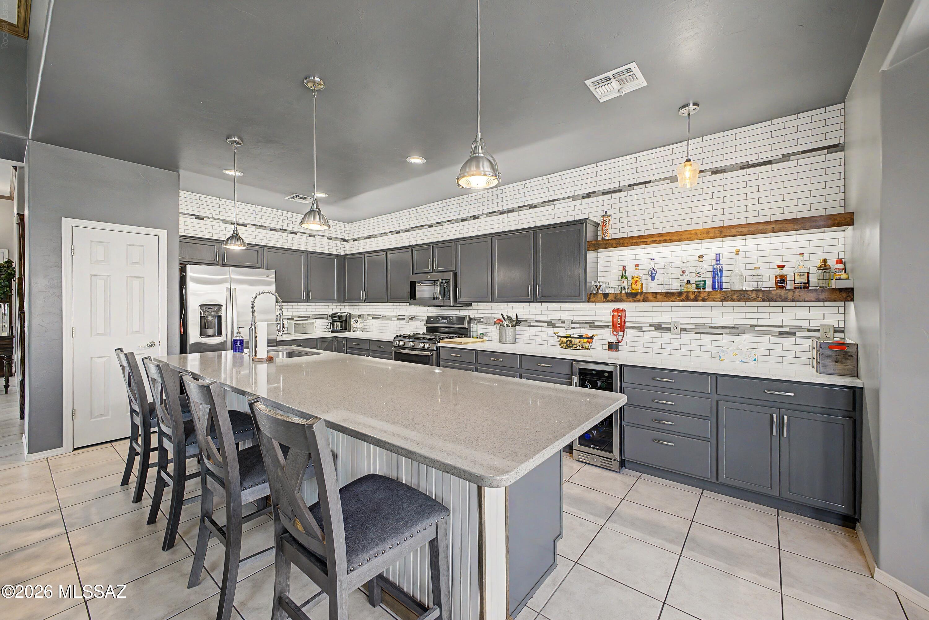 Seller will accept or counter offers btwn $509,000 to $519,000. Beautiful home in  gated Rancho Agua Dulce.  Updated kitchen w/engineered quartz countertops, huge island, wine fridge, warming drawer,  newer refrigerator and dishwasher, opens to family room with cozy fireplace w/built ins, formal living room & dining, crown molding,  upgraded staircase,  Owner suite is downstairs with updated shower, soak tub, flooring, large walk in closet.  Upstairs offers huge loft and large bedrooms.  laundry room downstairs w/new sink & backsplash, No carpet. Storage under stairwell. Roof 2024. Outside painted 2024. 3 car garage.  On cul de sac, large rear yard with mature vegetation. Community walking trails, pool, bb courts.