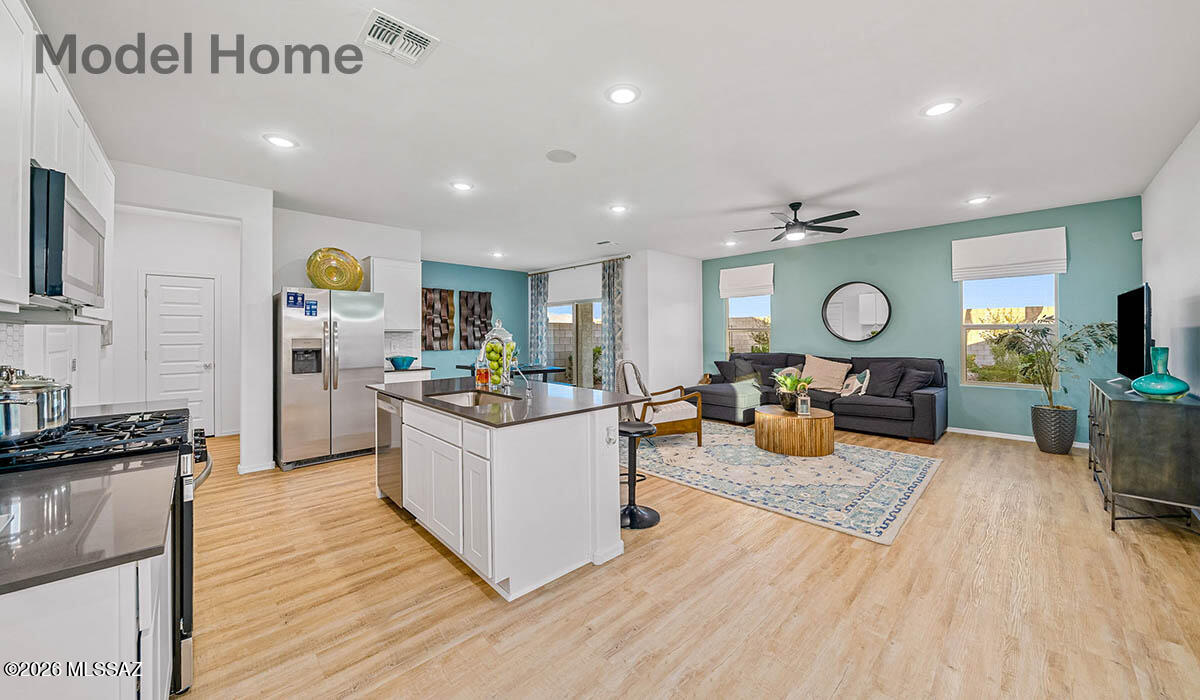 Discover the Kate at Hanson Ridge in Vail, Arizona - A beautifully designed 2,264 sq. ft. two-story new home that seamlessly blends functionality with style, offering a perfect retreat within the stunning desert landscape.

As you step through the welcoming front porch, you're greeted by a spacious entryway that leads directly into the heart of the home. The main floor is thoughtfully laid out to accommodate both everyday living and special occasions. The expansive great room opens into the dining area and the kitchen, creating a central hub for family gatherings and entertaining. The kitchen features  Quartz countertops, upgraded cabinets, modern appliances, and a large walk-in pantry, ensuring that both style and practicality are well met.  Under Construction.