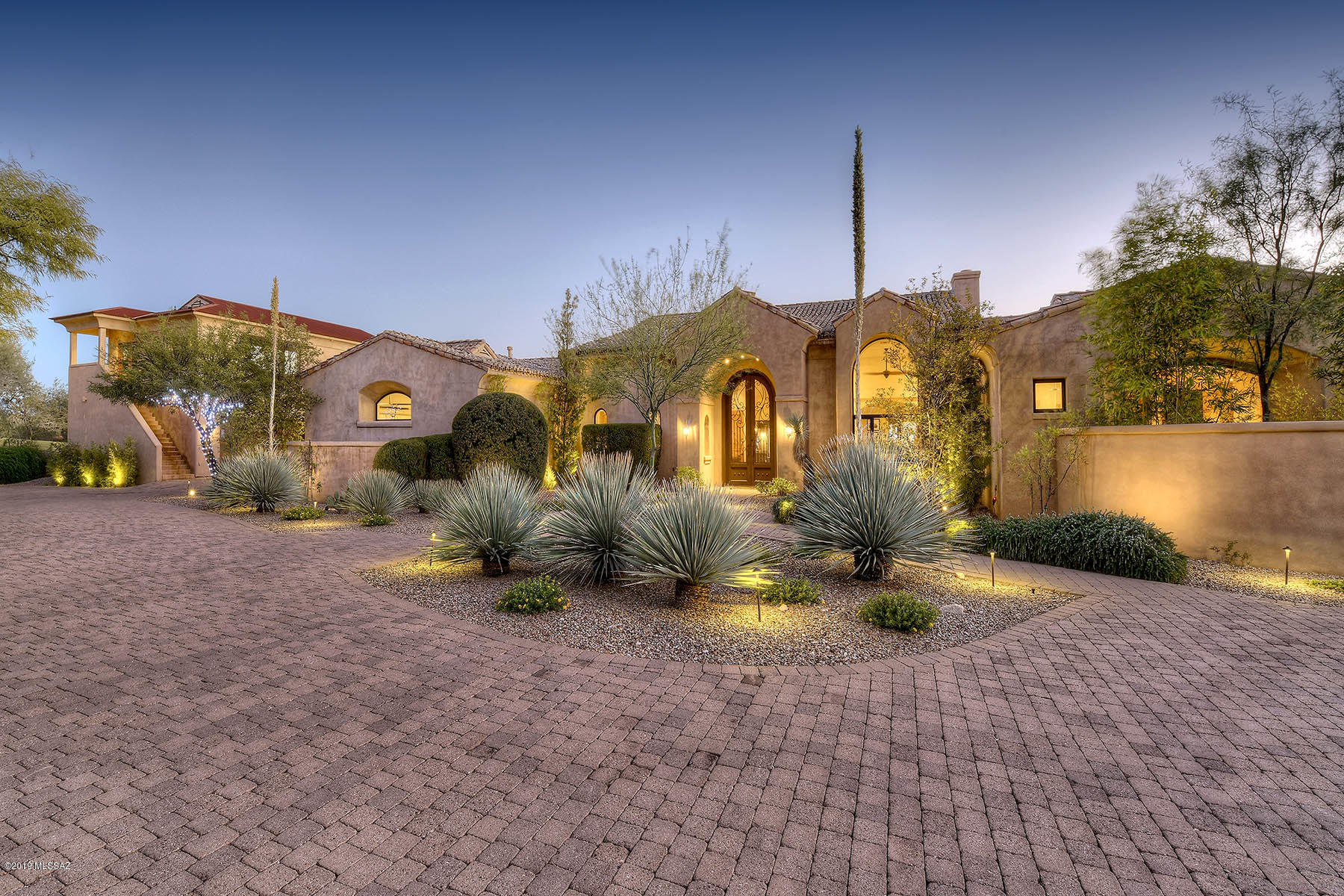 Luxurious resort style Skyline CC, golf course  home w/ phenomenal city & mountain views.  A grand entrance, 2 guest suites w/secluded exterior entrances & a commercial grade gym w/ its own full bath! Gourmet chefs kitchen w/ a fully equipped butler's pantry, large butchers block, granite sink & an oversized island that opens to a great room w/ a cozy fireplace. Step through a glass wall that slides open to the lavish backyard that makes you feel like you are living at a 5-star resort. Relax under your large covered patio or gaze onto the golf course & city lights from your negative edge pool & gorgeous spa. End the day by retreating to your master oasis, w/ a private patio & spa-like bath. Treat every day like a vacation in this home. Seller is a licensed real estate broker in Arizona