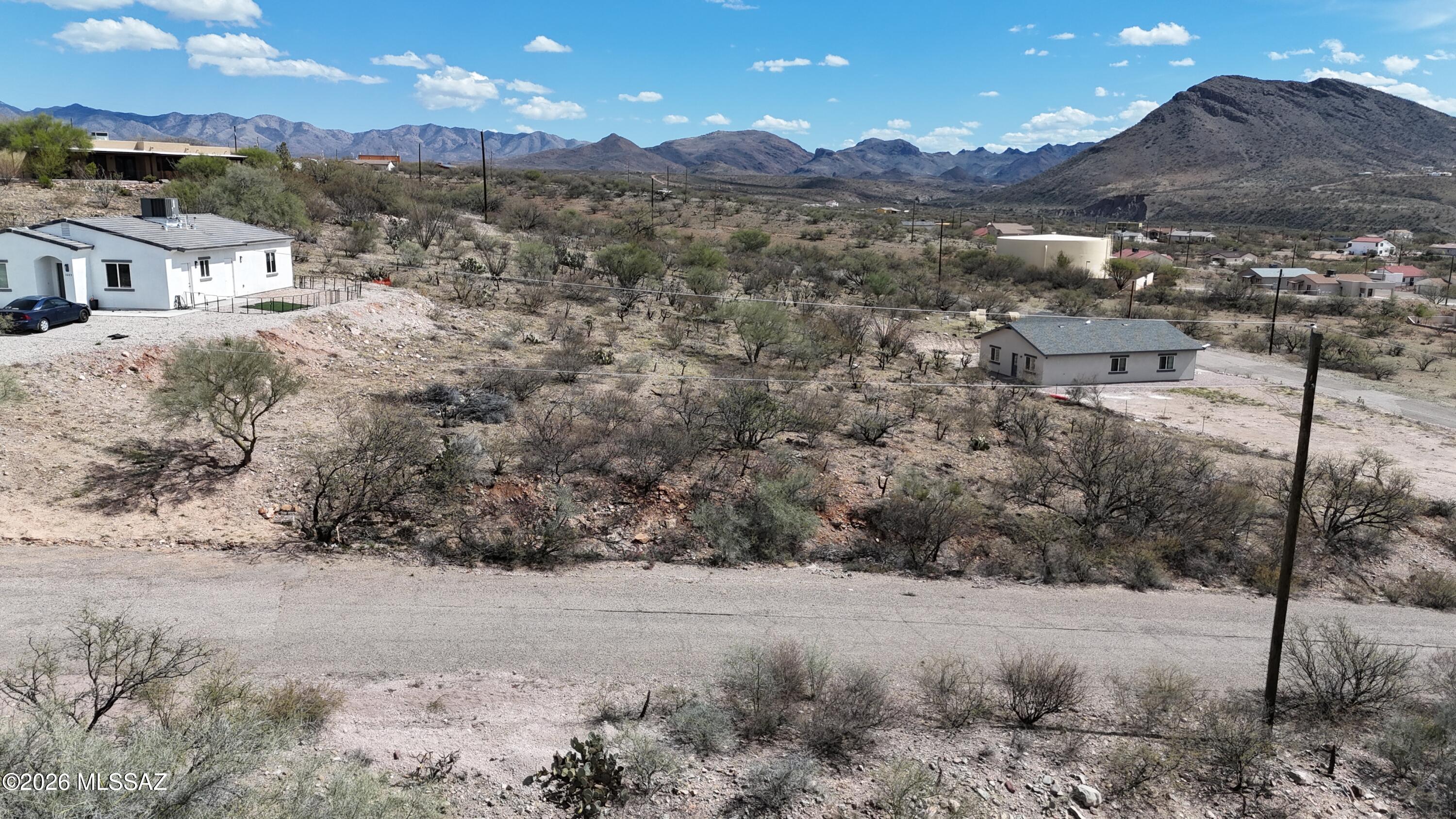 Residential lot with slightly raised location.  Paved access, electric, water and sewer at the street.