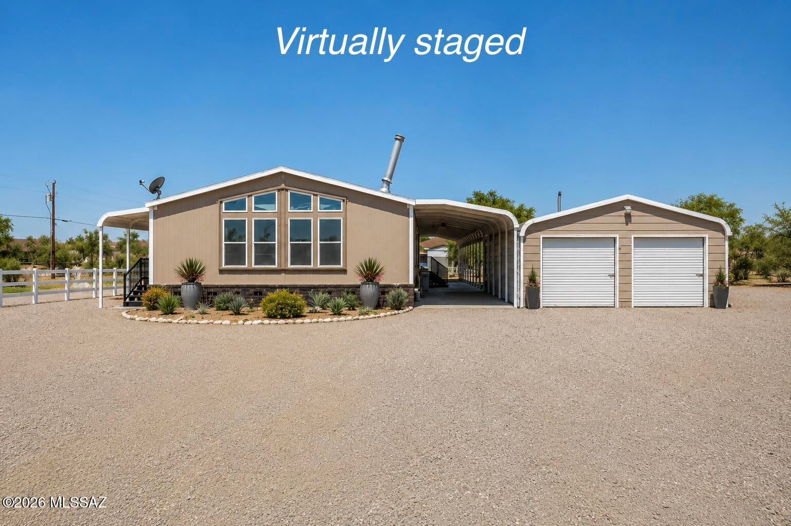 Ask about renovation loan! Investor opportunity- spacious home in the heart of Avra Valley on an acre lot! On a paved road, close to shopping, schools, & I-10! Detached garage, no HOA, and plenty of room for toys & animals! After repair value over $340,000 with recent sales!

This spacious 2,280 sq. ft. manufactured home offers incredible potential with a split-bedroom floor plan, detached 2-car garage/workshop, RV hookup, and plenty of room for horses, toys, or equipment. The home needs repairs and is priced accordingly, making it an excellent fix-and-flip or long-term investment. Convenient paved road access and endless possibilities for the right buyer. 

Sold AS-IS: needs new HVAC unit & complete refresh throughout. Don't miss your chance to unlock the value this property has to of