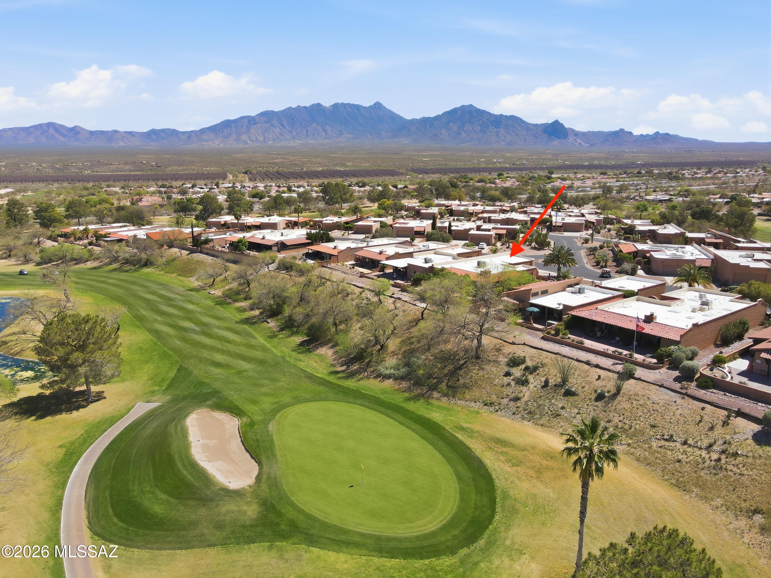 This 1685 sq ft Townhome is situated in a Prime Desert Ridge location w/Santa Rita Mtn Views from the Front Courtyard & a wraparound patio overlooking the Desert Hills Golf Course from the landscaped backyard w/custom wrought iron fencing. Open concept living w/Gas Beehive fireplace. Numerous updates/improvements inc. kitchen w/granite C/T's, pull outs, newer range/oven & sink. Pantry. Dining options include a custom mesquite breakfast bar, dining room & outdoor dining. Guestroom/Den has functional built-ins. Both bathrooms fully remodeled in 2024 w/luxury design features. Golf course Views from Primary bedroom w/lg walk-in closet & walk-in shower. Tile flooring, carpet in bedrooms. 2025 Lennox HVAC. Roof to be recoated April 2026. Re-plumbed throughout. Exterior storage room. 2-car garage