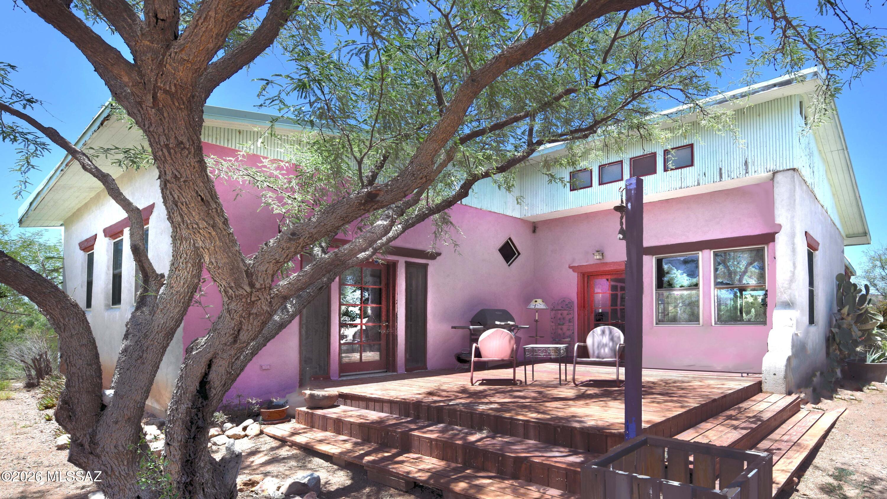 Stunning heart-of-Patagonia hilltop setting  ~uncommonly pleasing for its privacy & 360 mountain views of its renown Sky Island habitat. Built of substantial Rastra/ICF Block c.2004, its 1779sf feature soaring ceilings & many windows & outdoor seating areas from which to savor this amazing setting. The home has just the one o/s Master Bedroom & the single Bathroom, which is directly across the wide hallway from the Master. The sunny multi-purpose Bonus Rm could be used however you wish, including a BedRm. The GreatRoom is nicely proportioned & includes Living-Dining area, Kitchen, & walk-in Pantry. It opens out to both the AZ Rm & the Front Entry Deck. The directly adjacent 200'x135' parcel may be purchased with a separate bill of sale. What a great horse property or guest house setting!