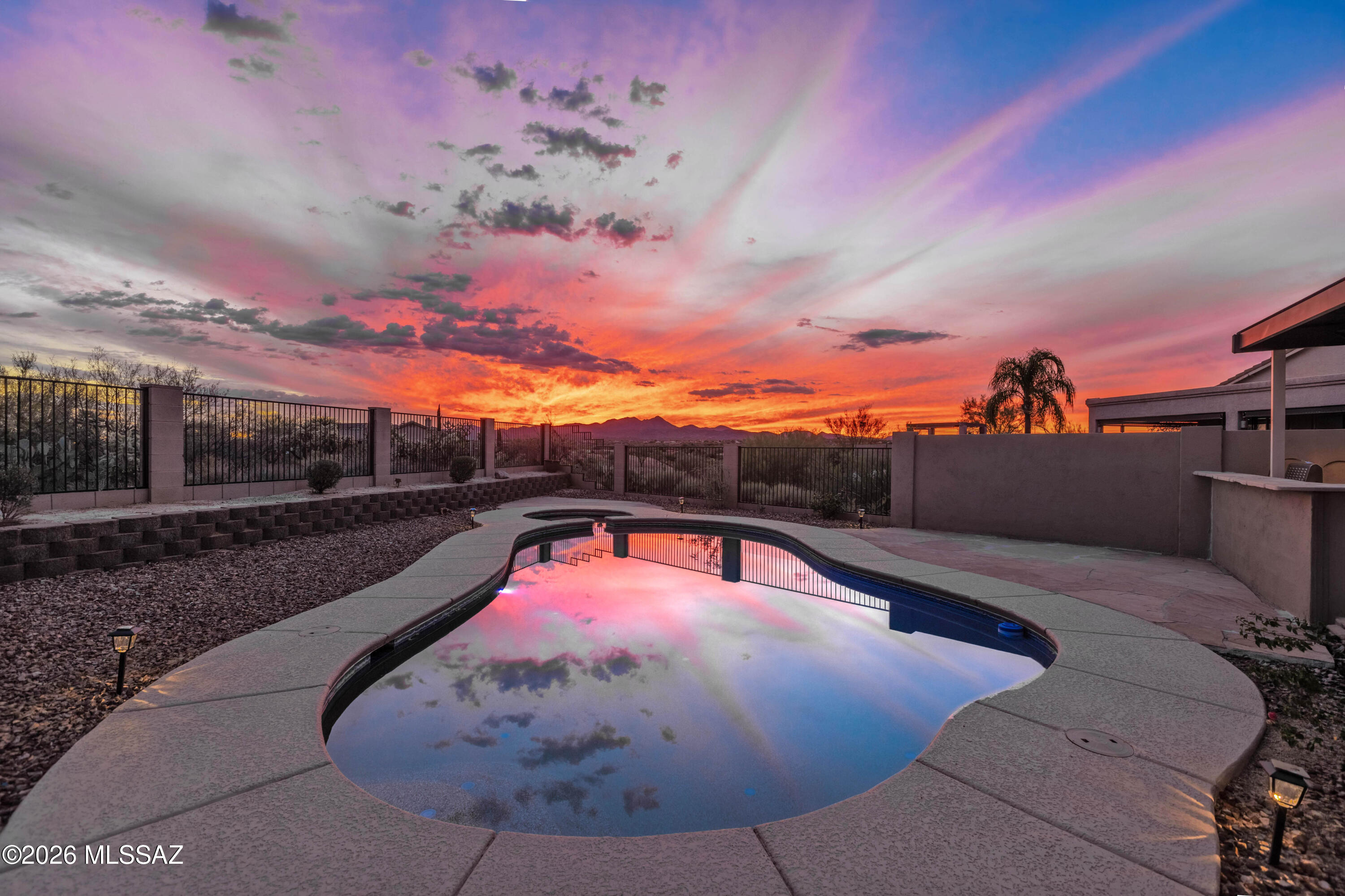 Luxurious Outdoor Living with Unparalleled Mountain Views! Beautifully updated 4-bedroom home backing to miles of natural open space with breathtaking mountain views and exceptional privacy. The resort-style backyard is designed for entertaining with a heated pool, new Kool Deck, covered patio with sunscreens, and a fully equipped outdoor kitchen featuring a BBQ, refrigerator, sink, and fireplace. The remodeled kitchen offers quartz countertops, new stainless-steel appliances, breakfast nook, and opens to the family room. The spacious primary suite features a spa-inspired bath and walk-in closet. Additional upgrades include tile flooring, new carpet, 3-car garage, new HVAC, newer roof, new water heater, fresh interior paint, and more. Truly move-in ready!
