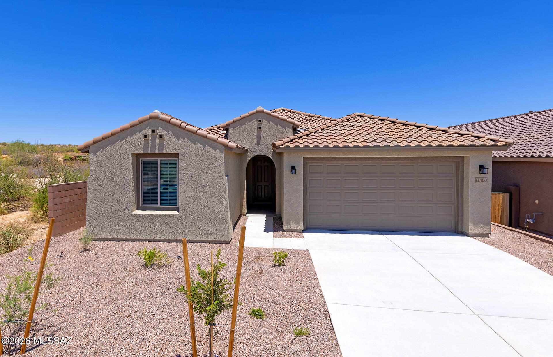 This brand-new Designer Home will be move-in ready in May 2026. The popular split floor plan features a distinctive Spanish exterior and a beautifully appointed interior. The chef-inspired kitchen includes a gas cooktop, stainless steel Whirlpool appliances, upgraded Coastal Shaker Maple cabinets in the Moonlight finish, Bianco Aspen quartz countertops, and a custom backsplash.

The owner's bath, as well as Baths 2 and 3, showcase matching Bianco Aspen quartz for a cohesive, elevated look. Additional upgrades include 12''x24'' Modern Oasis Morning Haze tile laid in a clean straight-stack pattern.

Built with energy-efficient features, the home includes a tankless water heater, low-flush toilets, low-flow showerheads, dual-pane Low-E windows, and more.