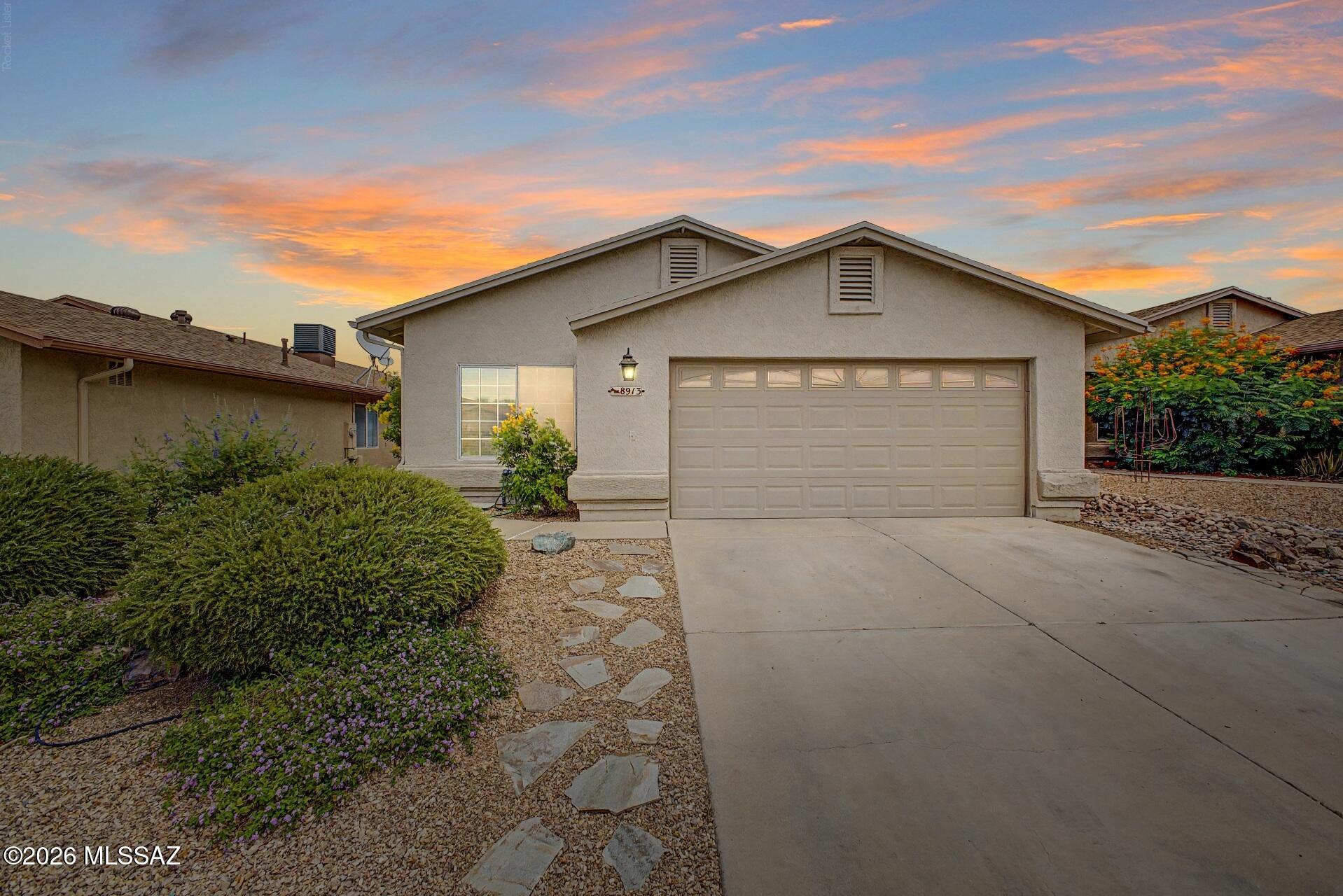 Welcome home to 8913 E Citrus Tree Drive, a beautifully updated single-story residence nestled in a quiet Southeast Tucson neighborhood. Offering 1,515 sq. ft. of thoughtfully designed living space featuring 4 full bedrooms and 2 bathrooms, this home combines space, energy efficiency, and low-maintenance modern living.

Step through the entry into a light-filled family room with low-maintenance 18-inch diagonal tile flooring across main living areas and cozy carpet in the bedrooms. The open layout flows seamlessly into an updated kitchen equipped with a gas stove, solid granite countertops, stainless steel appliances, and a window overlooking the private yard.

Enjoy significantly reduced utility bills and year-round eco-friendly efficiency thanks to the home's leased solar system --providing reliable, low-cost energy through Tucson's warmest months.

Step outside into your private outdoor retreat featuring a premium synthetic turf backyard. Fully block-fenced for privacy, this lush, evergreen setup requires zero mowing and minimal water usage, providing the ultimate turnkey space for pets, outdoor dining, or entertaining under the extended covered patio.

Located near local parks, top schools, and convenient commuter routes, 8913 E Citrus Tree Drive delivers true 4-bedroom versatility, solar savings, and effortless outdoor living.