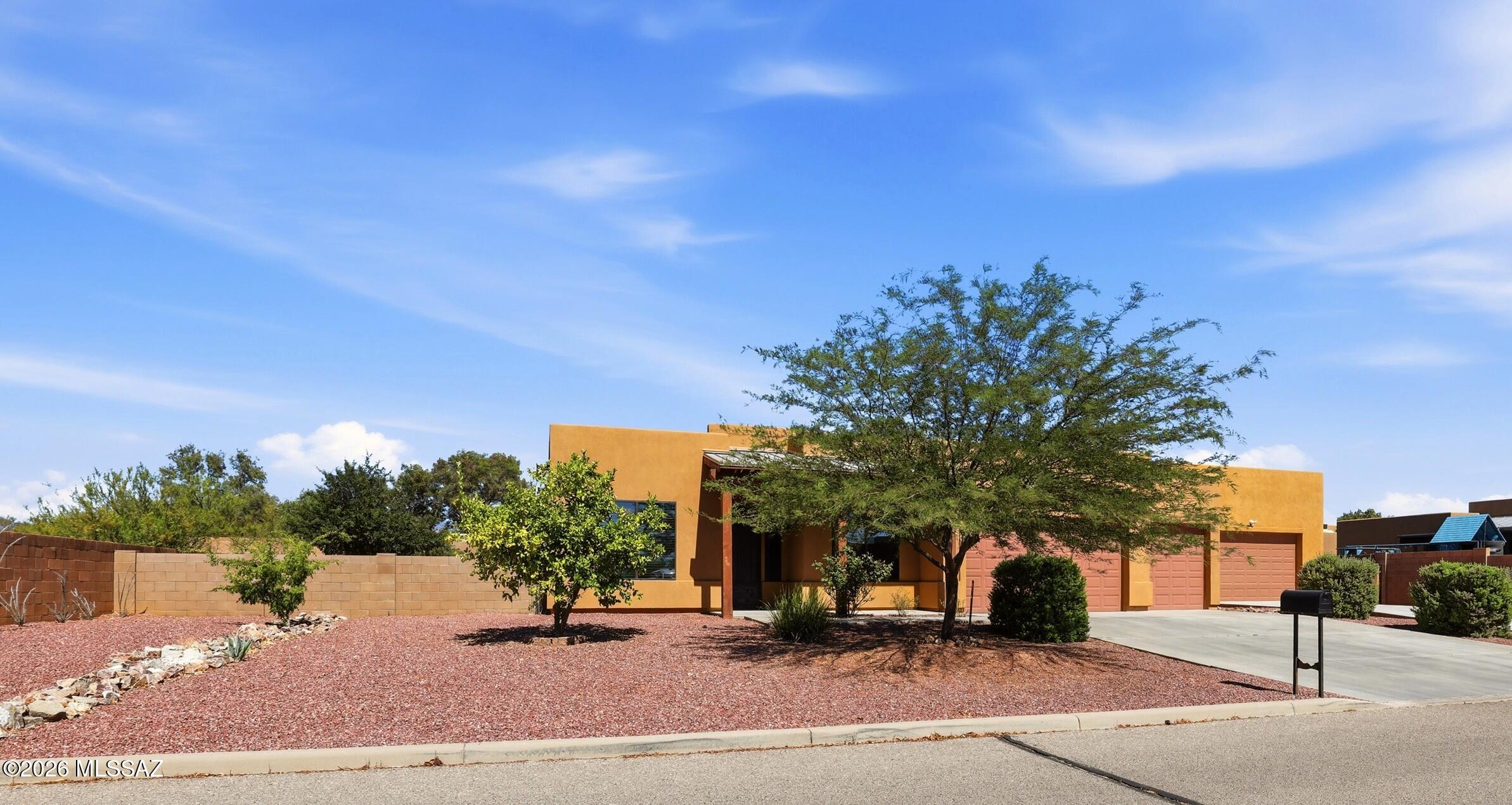3 BR/ 2 BA/ +Den Corner Lot in Rincon Trails, an automotive enthusiast's paradise! This
property features an attached 3 car garage in addition to a massive 3-car detached garage with extra length, plus an automotive lift! Inside features a split floorplan with a spacious primary suite including access to the backyard which is designed for entertaining. From the built-in firepit
with ample seating, to the massive wooden covered patio, along with an above ground pool as well as extra spaces for gathering: the lush grass, decorative gravel, or artificial turf. There is also a storage shed conveniently located near the garage. This gem in Vail is definitely unique! Near Rincon Trails Playground and Park which features sports courts, picnic facilities, trails and
more.