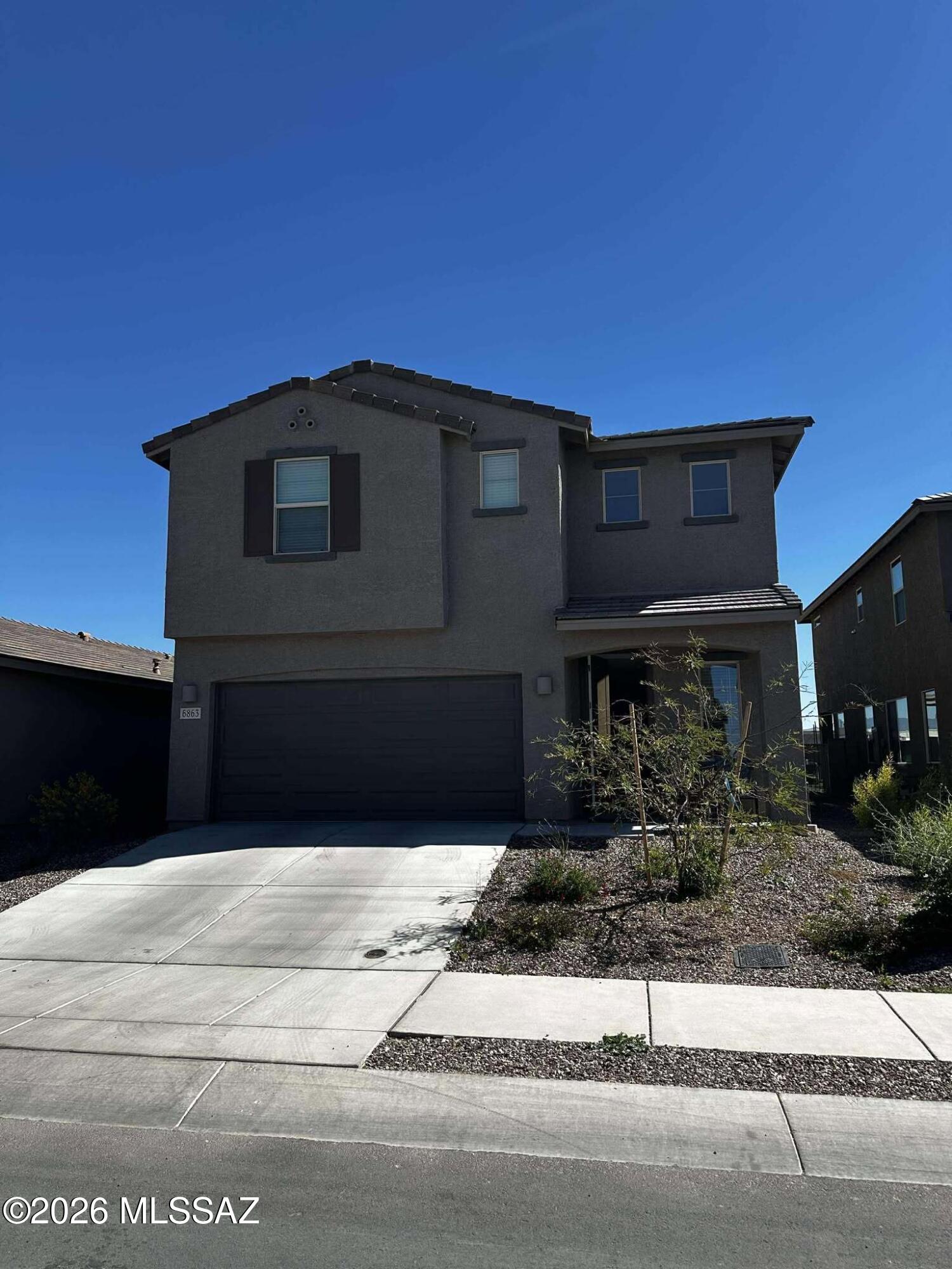 This newer 4 bedroom, 2.5 bathroom home, built in 2024, offers 2,384 sq. ft. of modern living space in a desirable east Tucson location. Located near I-10 & Kolb Rd, this home features an open concept kitchen with plenty of space to prepare meals, energy efficient multispeed HVAC systems, and high performance air filtration to ensure comfort year round. Enjoy laundry with an included washer, dryer, and convenient sink, and relax in the spacious living room that opens up to a covered patio with both mountain and city views. Upstairs, you'll find a spacious loft perfect for family time or as a home office and generously sized bedrooms. This home also includes ceramic tile and carpet flooring, blinds, drapes, and a 2 car garage for added convenience.